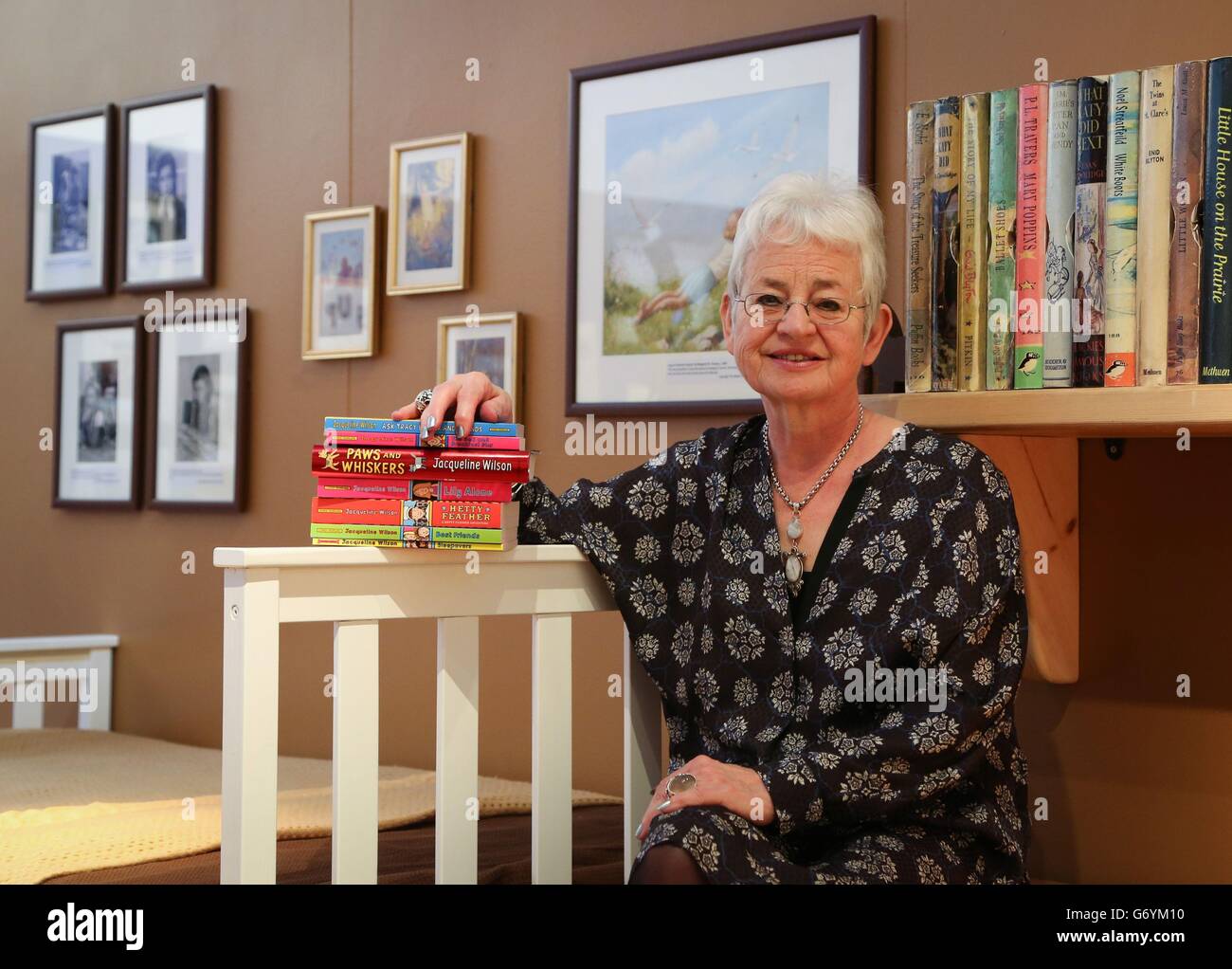 Dame Jacqueline Wilson poses for photographers in a recreation of her