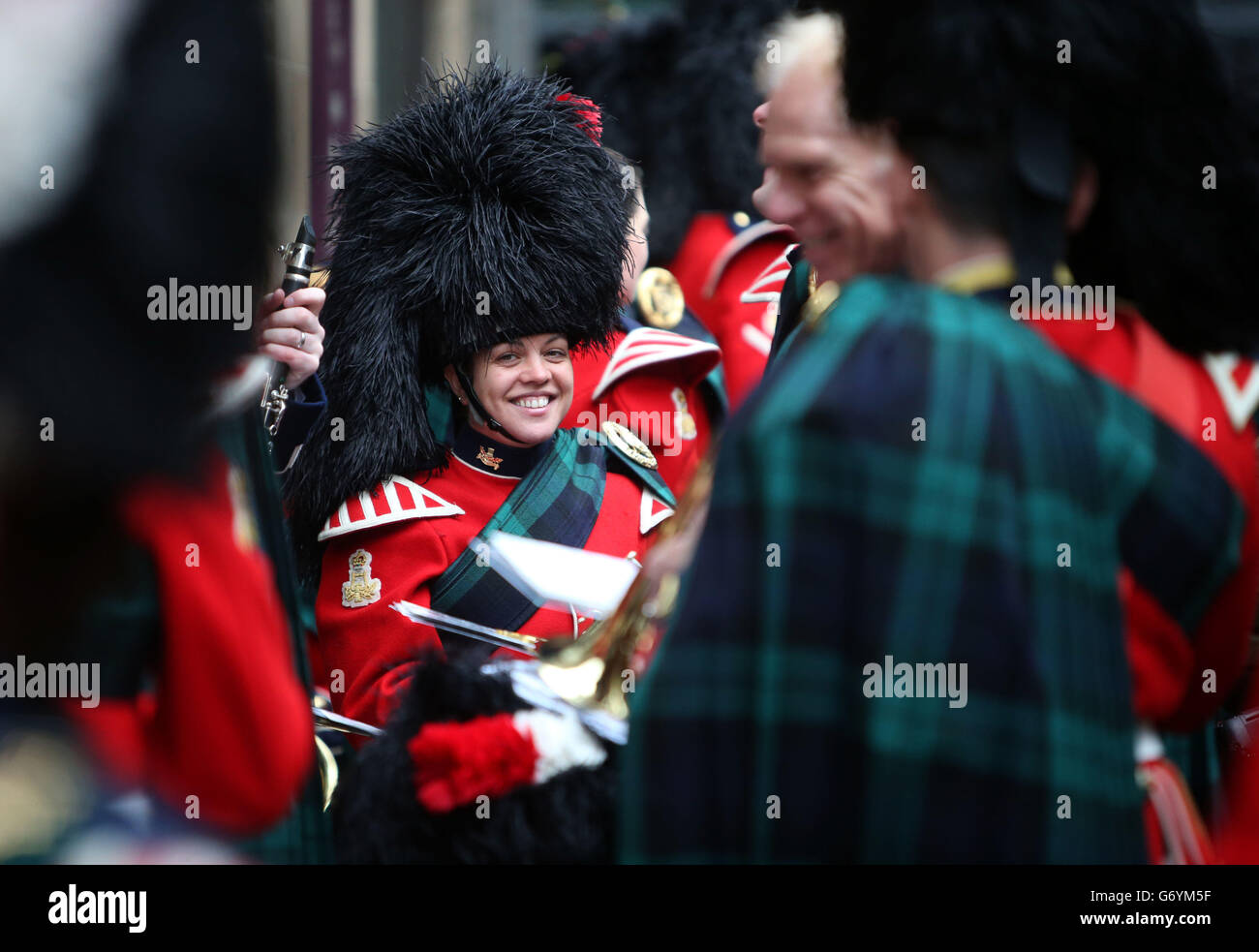 Members of the band of the Royal Regiment of Scotland prepare to play ...