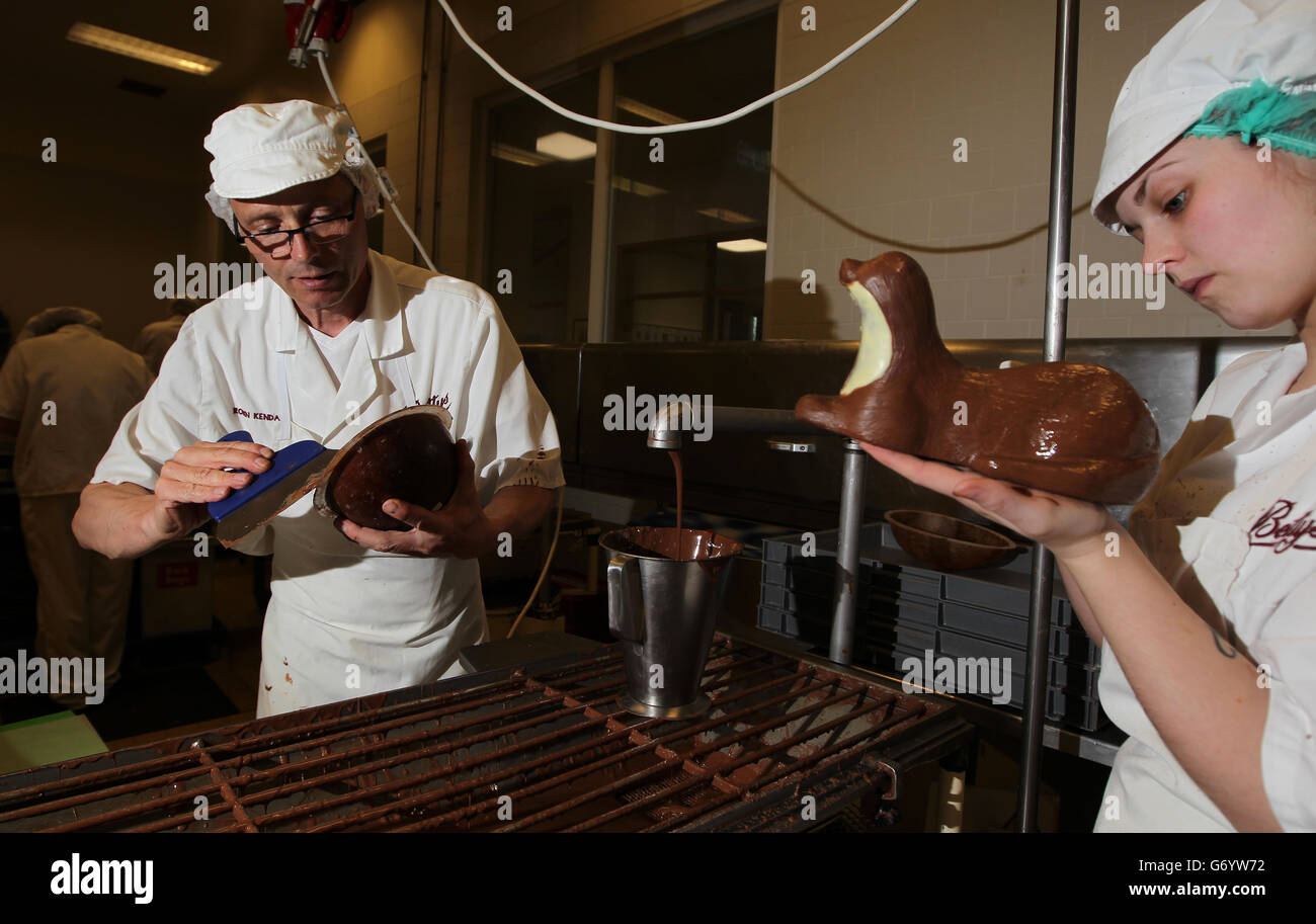 Robin Kendall fills an egg mould as Amber Keir (right) hand finishes an