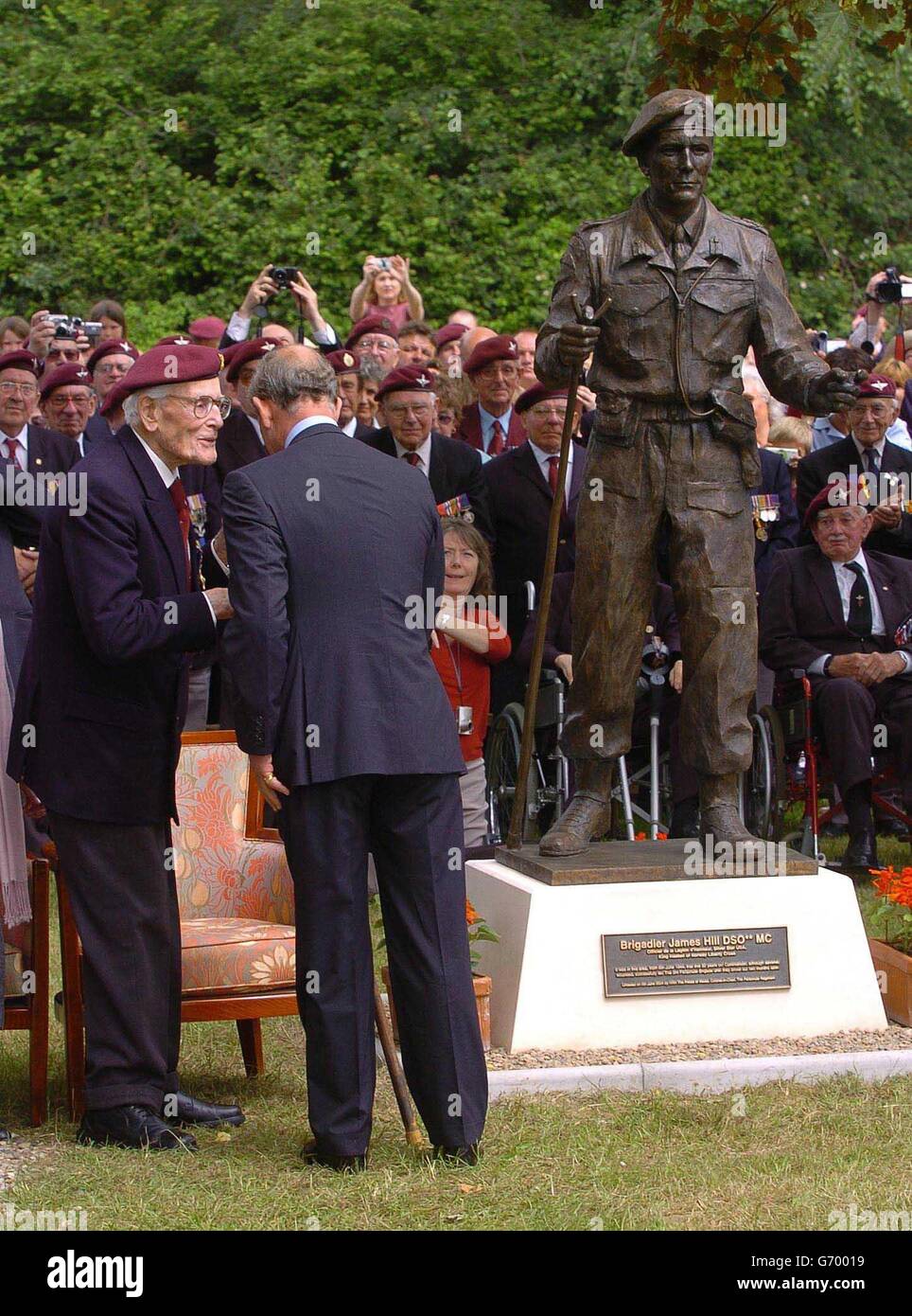 The Prince of Wales greets veterans from 3rd Parachute Brigade, at Le Mesnil, in Normnady, north west France where he also unveiled a statue of the Brigadier Sir James Hill - the last surviving officer of Brigadier / General rank of the Normandy campaign. The Prince is in north-west France for a day of engagements on the eve of the 60th anniversary of the Allied invasion of Europe. Stock Photo