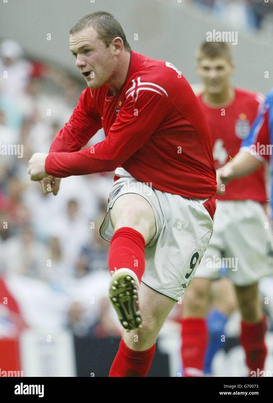 England's Wayne Rooney scoring his second goal against Iceland during their international friendly match at the City of Manchester Stadium Saturday June 5 2004. Stock Photo
