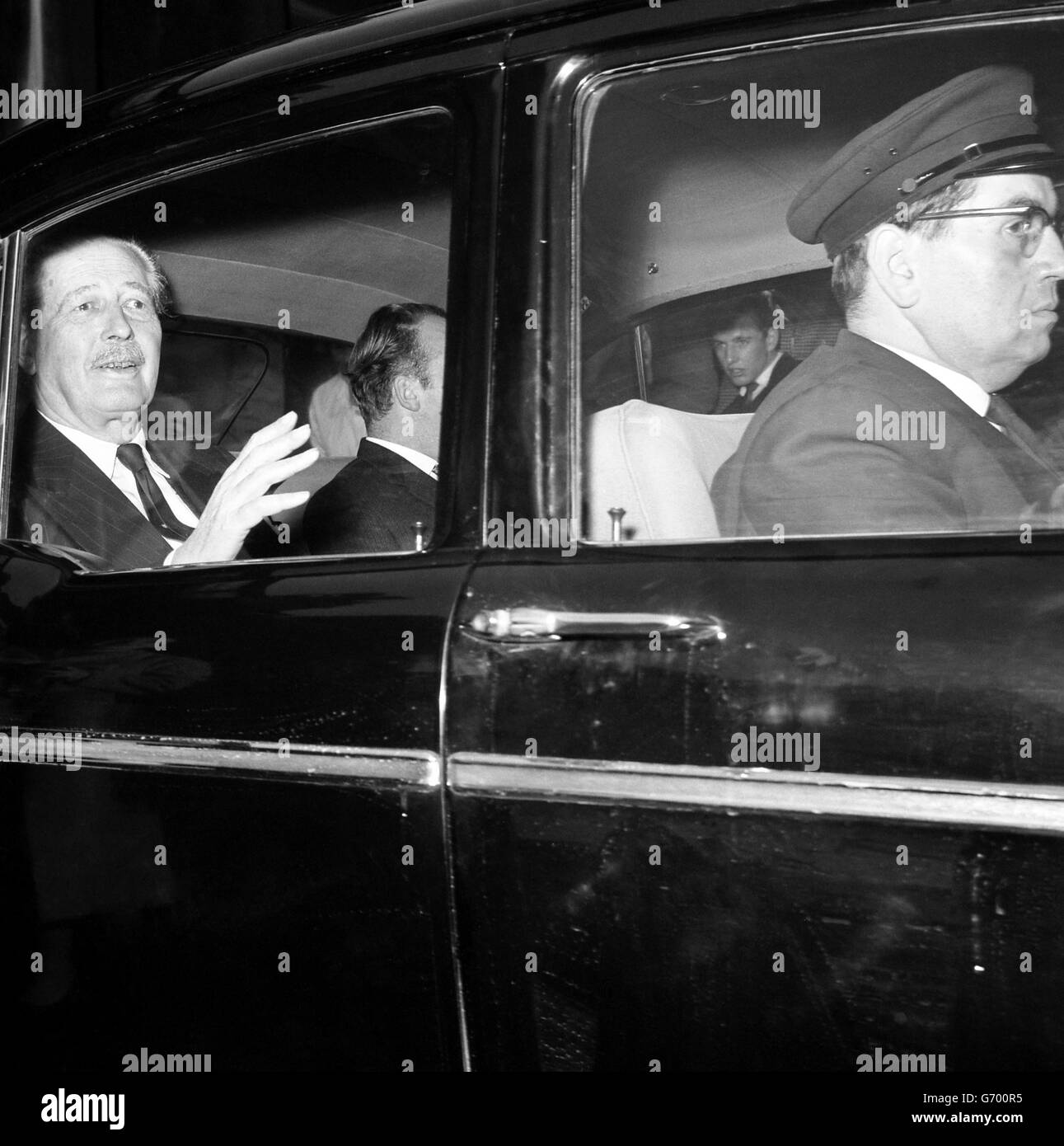 The Prime Minister, waves to bystanders as he drives from Admiralty House London, S.W., on his way to the House of Commons, where he was to make a statement on the Cuban crisis. Parliament reassembled for Prorogation, the ceremony winding up the present session. The Queen will open the new session. Stock Photo