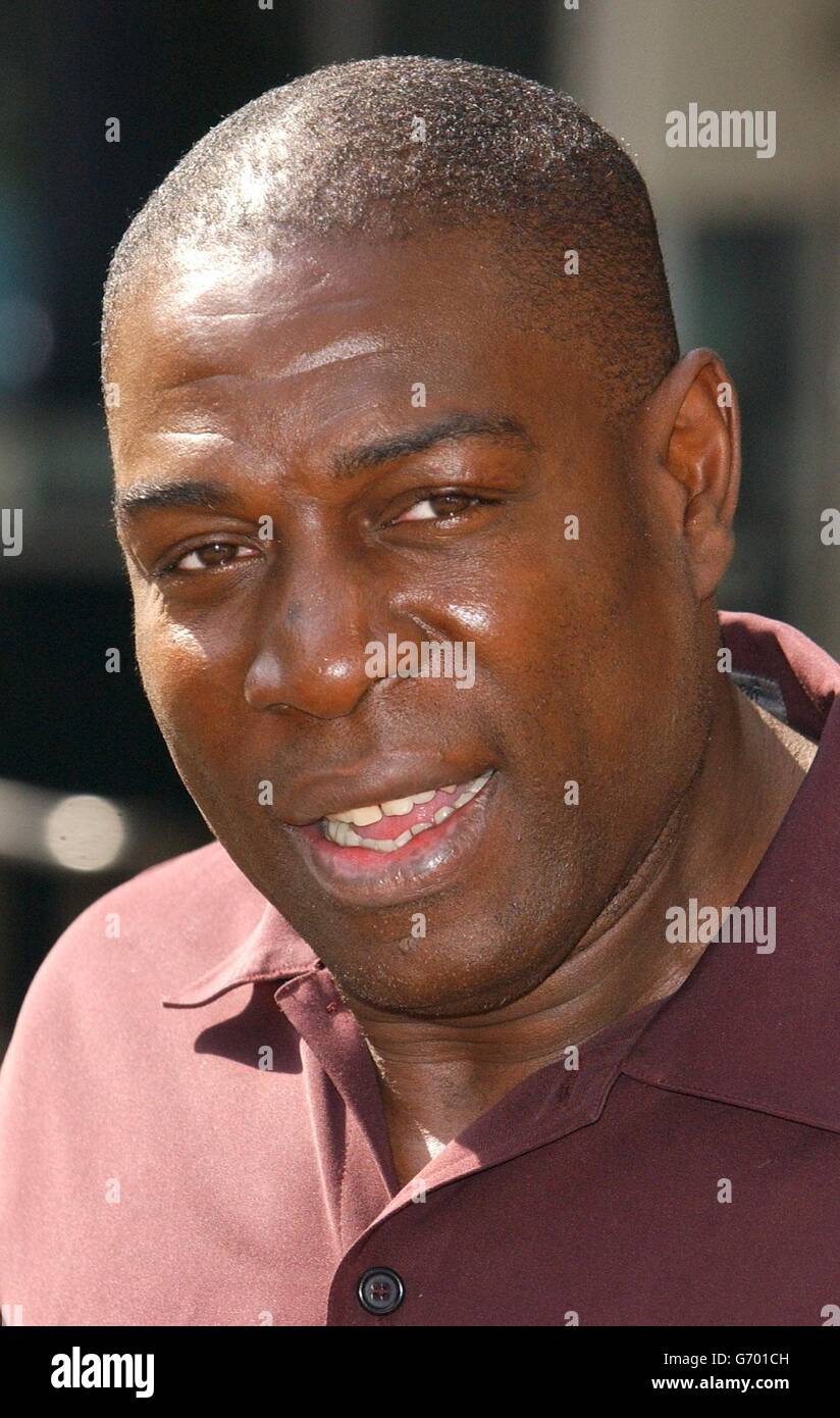 Frank Bruno poses for photographers outside The Sports Cafe in London's Haymarket. Stock Photo