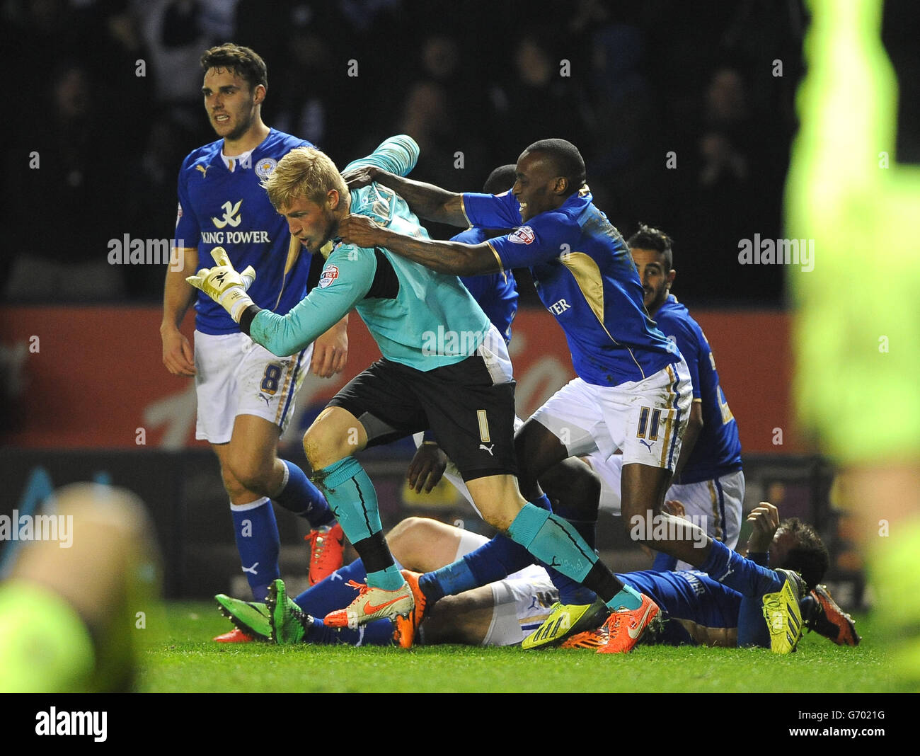 Leicester City's Kasper Schmeichel (left) and Lloyd Dyer (right) celebrate after Chris Wood (out of picture) scored the equalising goal against Yeovil Town during the Sky Bet Championship match at the King Power Stadium, Leiceste . Stock Photo