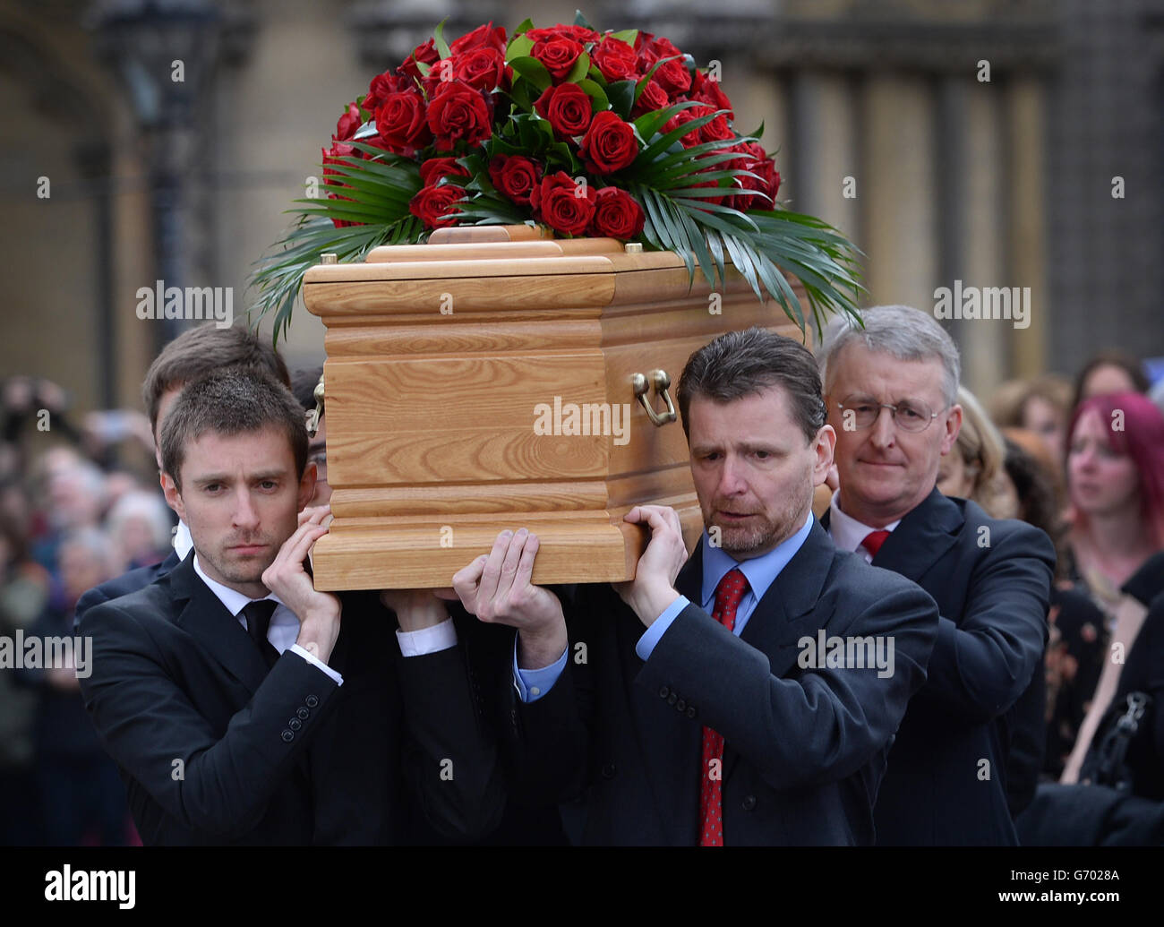 The coffin of former Labour MP and cabinet minister Tony Benn is carried by members of his family following his funeral at St Margaret's Church, Westminster, central London. Stock Photo