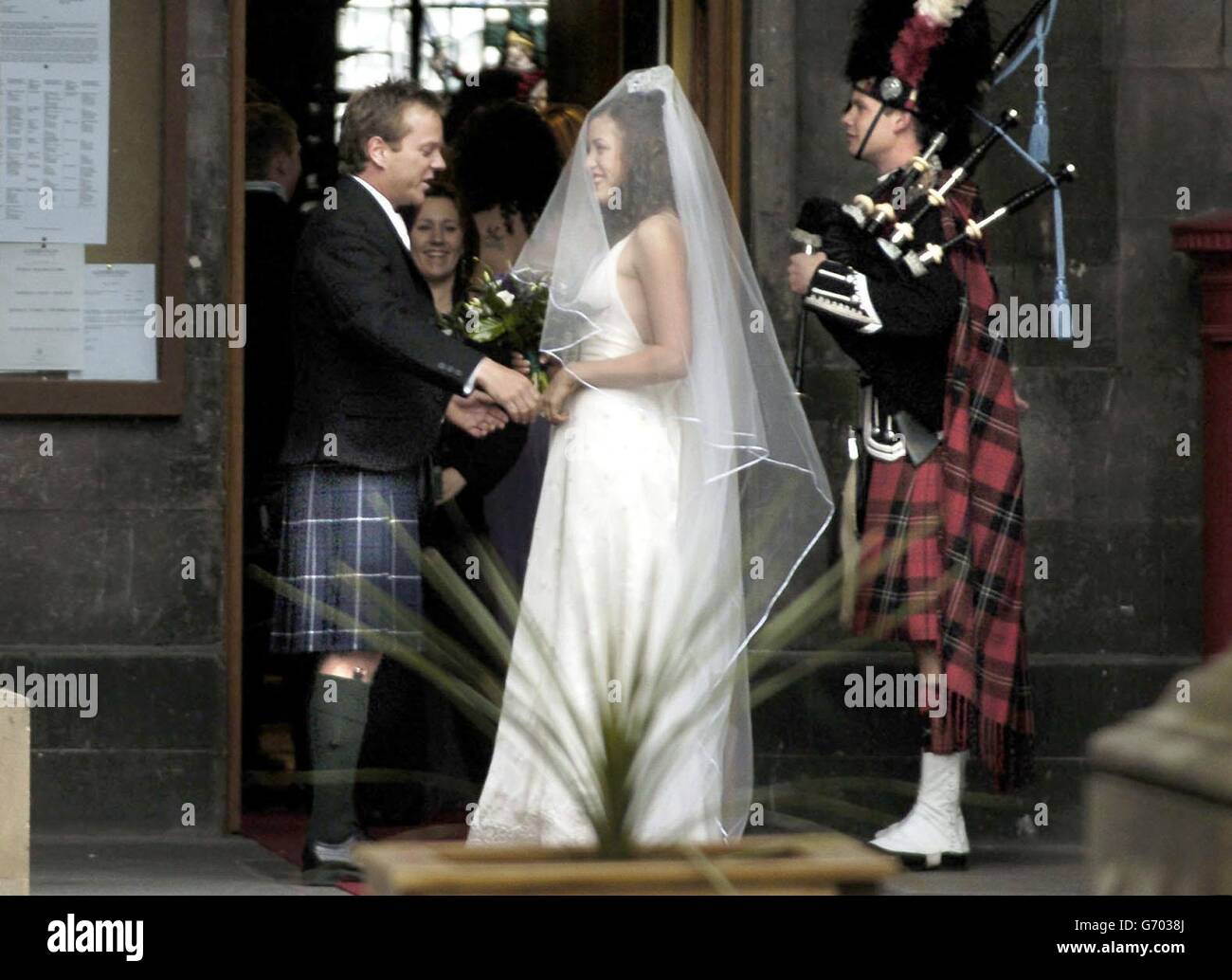 Hollywood actor Kiefer Sutherland at the wedding of his step-daughter to a Scottish actor. The star of Flatliners and cult television series 24, wore a stylish Douglas tartan kilt for the marriage of Michelle Kath, the daughter of his first wife Camelia, to actor Adam Sinclair. Sutherland chatted to fans and posed for photographs before the ceremony began at Edinburgh's City Chambers. The reception is also expected to be held in the grand city council headquarters on the Royal Mile. Stock Photo