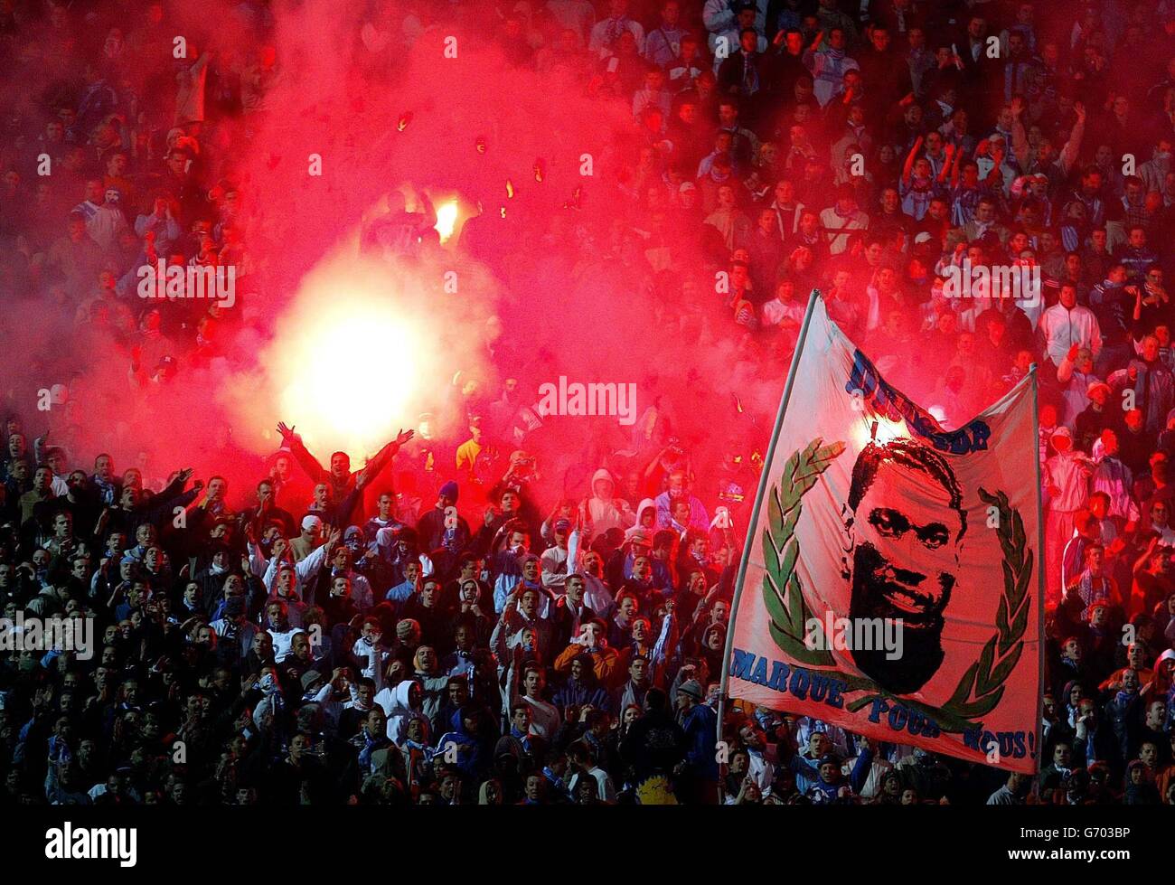 Marseille fans wave the flag with goal scorer Didier Drogba, after their UEFA Cup semi-final 2nd leg 2-0 win against visitors Newcastle United, at the Velodrome Stadium in Marseille. Stock Photo