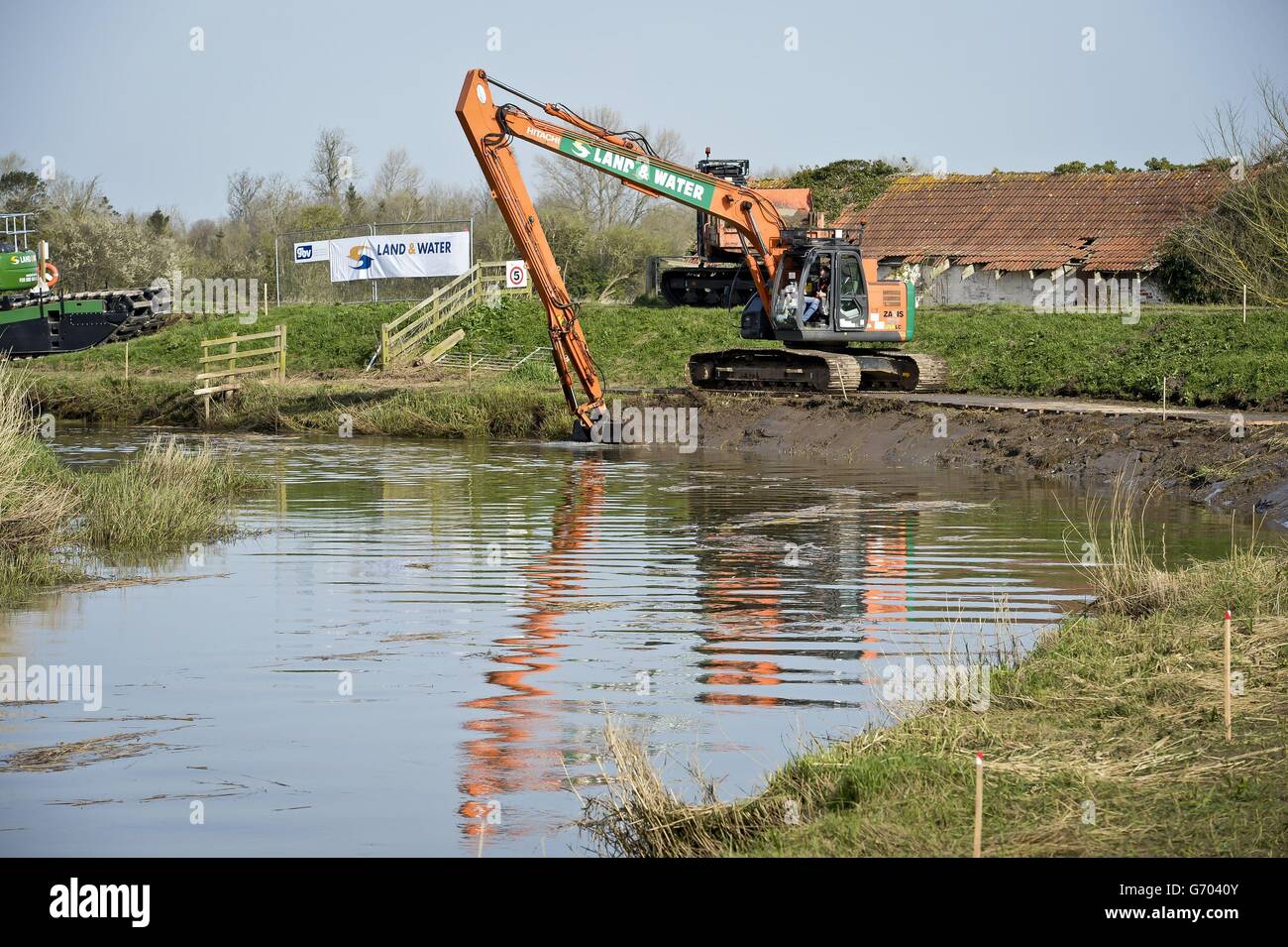 Dredging begins on the River Parrett, near Burrowbridge in Somerset, where the area suffered flooding. Stock Photo