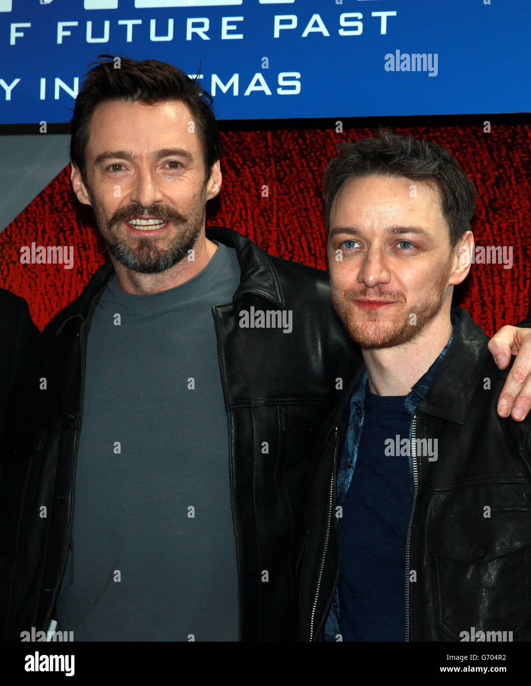 Hugh Jackman (left) and James McAvoy name a Virgin train at Euston station in London to celebrate Virgin Trains partnership with Twentieth Century Fox Film Corporation to be the official travel partner of X-MEN: Days of Future Past. Stock Photo