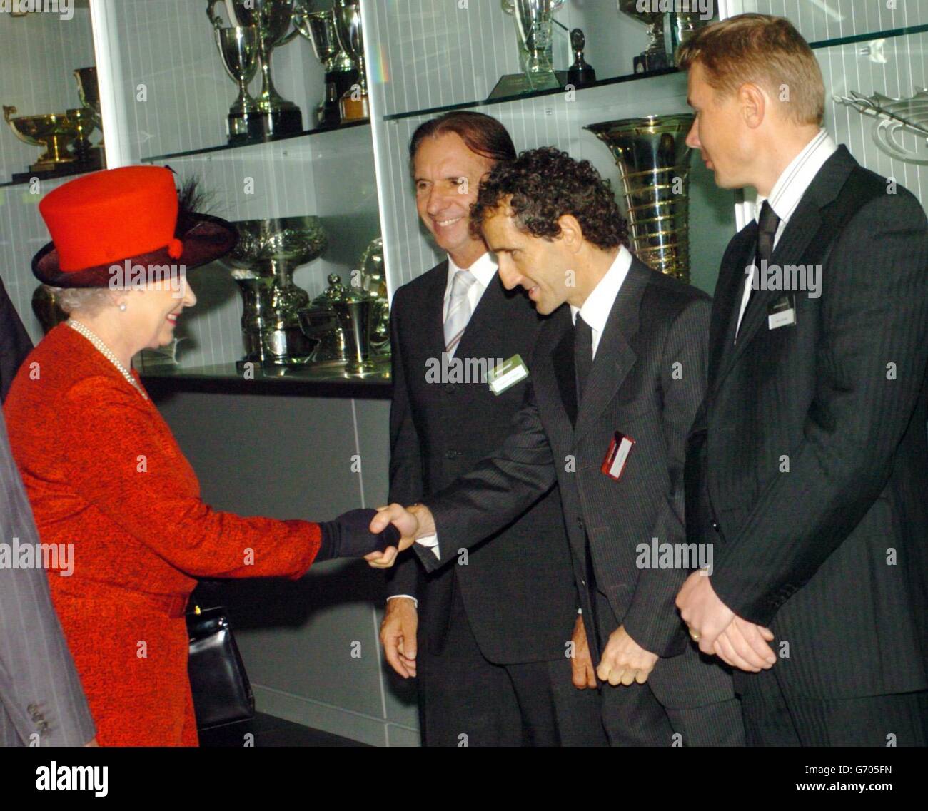 Queen Elizabeth II meets, from left, Emerson Fittipaldi, Alain Prost ...