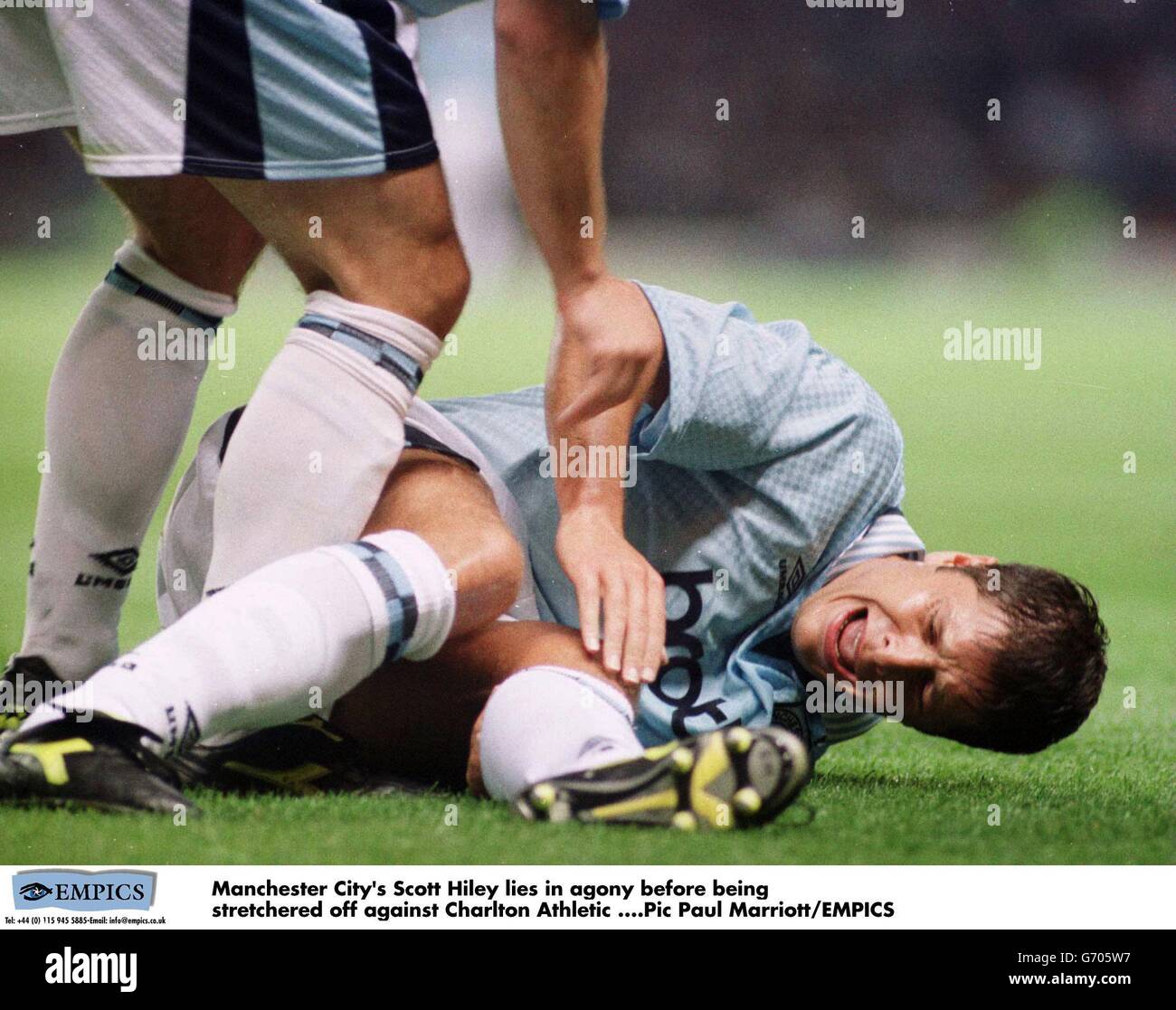 Manchester City's Scott Hiley lies in agony before being stretchered