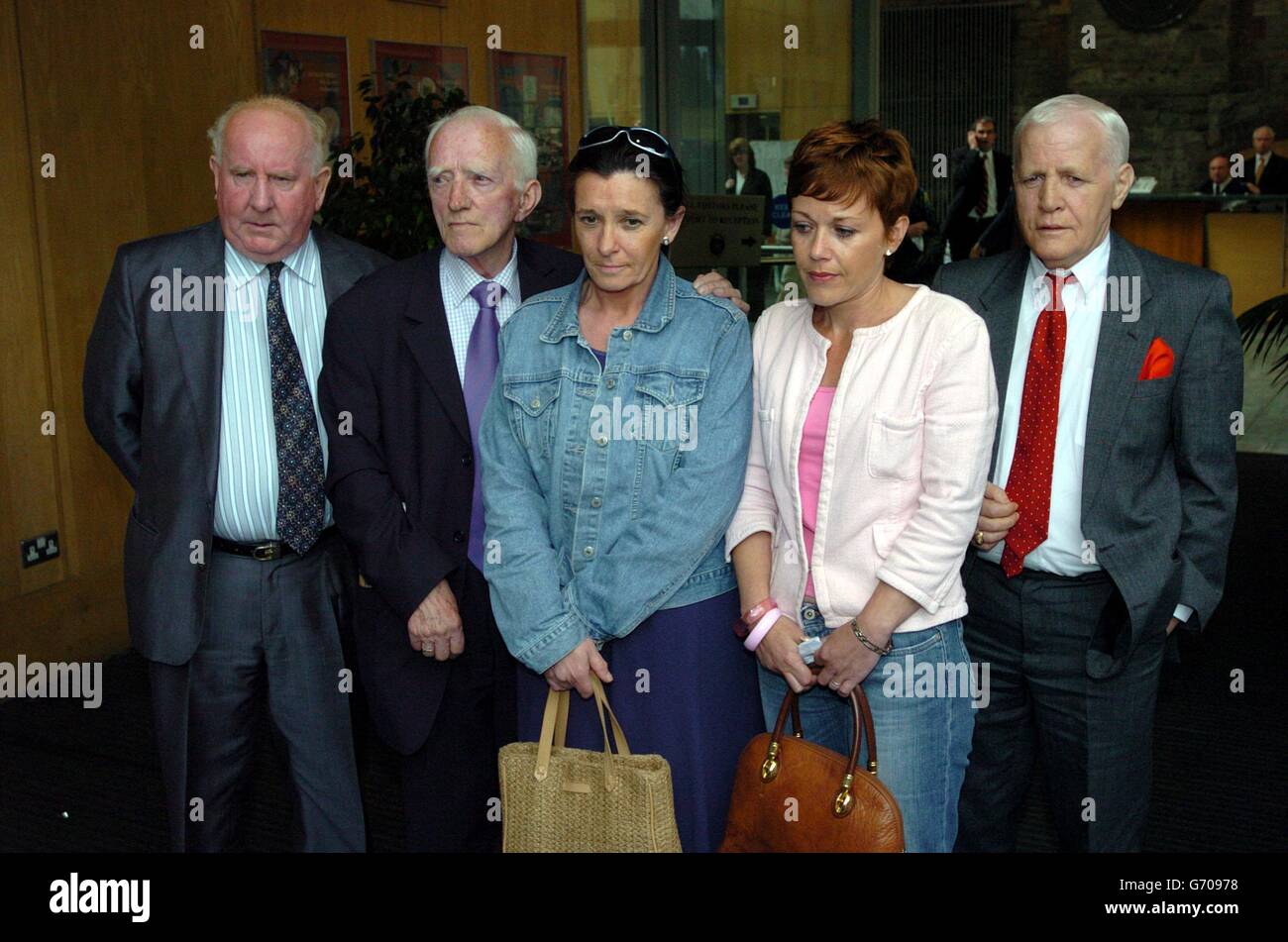 Family members of Dublin and Monaghan blast victims (l/r) Tim Grace, Frank Massey, who lost his daughter Anna Massey, Terry Massey, Angela O'Neil and Michael Caffrey, after the Dublin and Monaghan Bombing Tribunal came to an end, at the Distillery Building, Dublin, Ireland, today, a jury returned a verdict of unlawful killing of the 34 people who died. Stock Photo