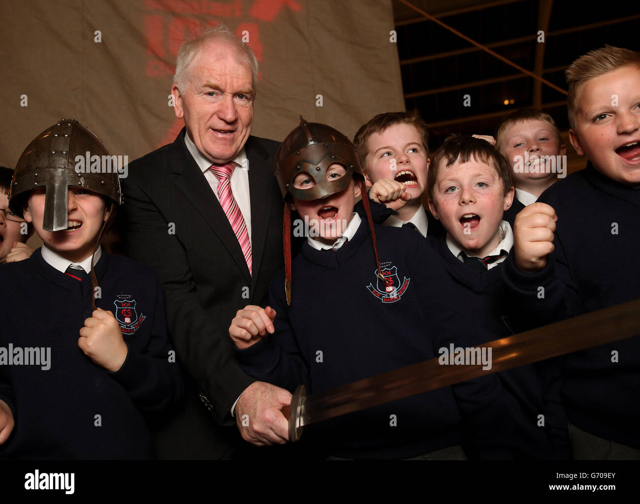 Jimmy Deenihan T.D, Minister for Arts, Heritage and the Gaeltacht with pupils from Catholic University School, Leeson Street, at the launch of two exhibitions, at the National Museum of Ireland, Dublin, to mark the 1000th anniversary of the Battle of Clontarf. Stock Photo