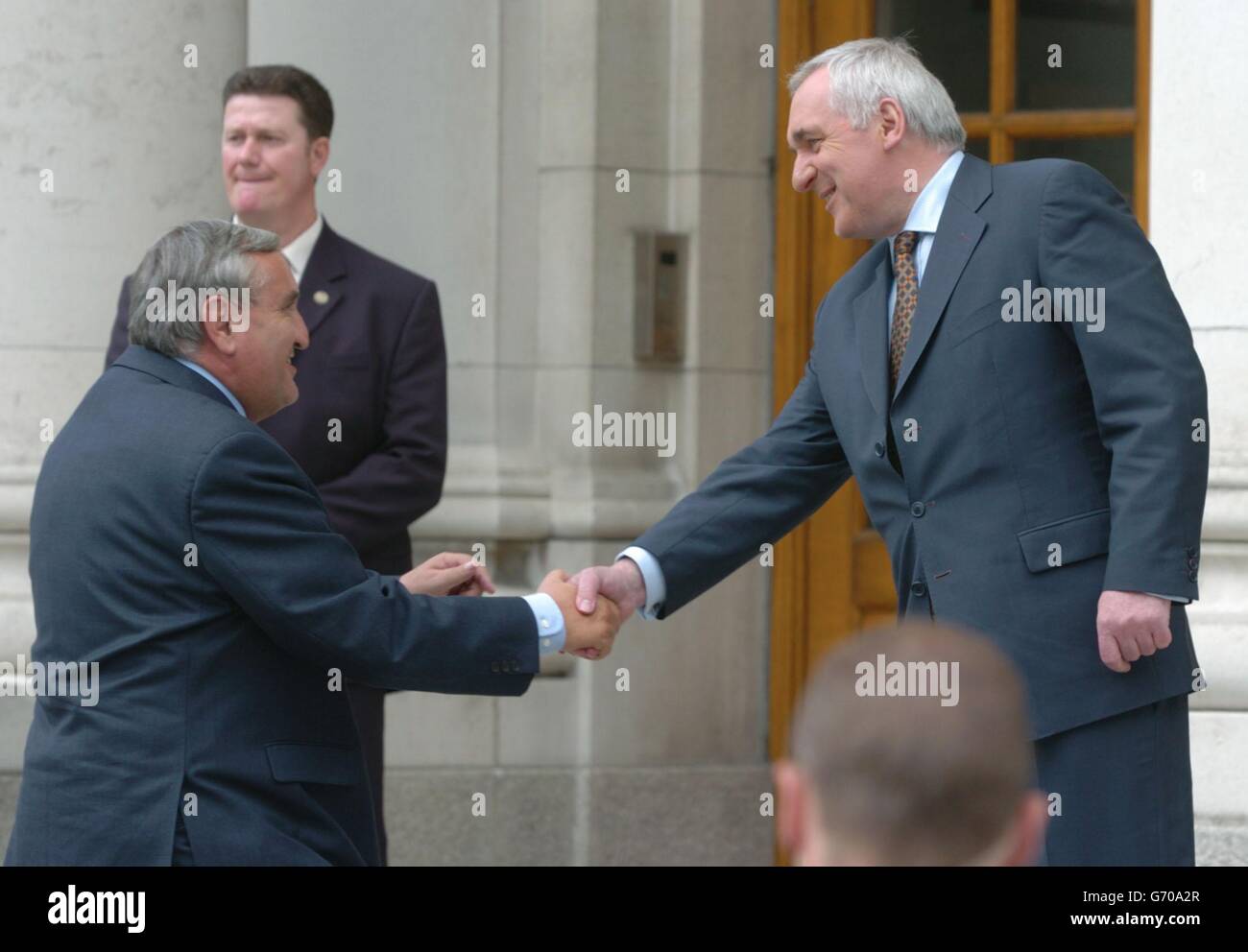 French Prime Minister, Jean-Pierre Raffarin (left) is greeted by Taoiseach, Bertie Ahern at Goverment Buildings, Dublin, Ireland, on his visit to mark the Irish EU Presidency. Stock Photo