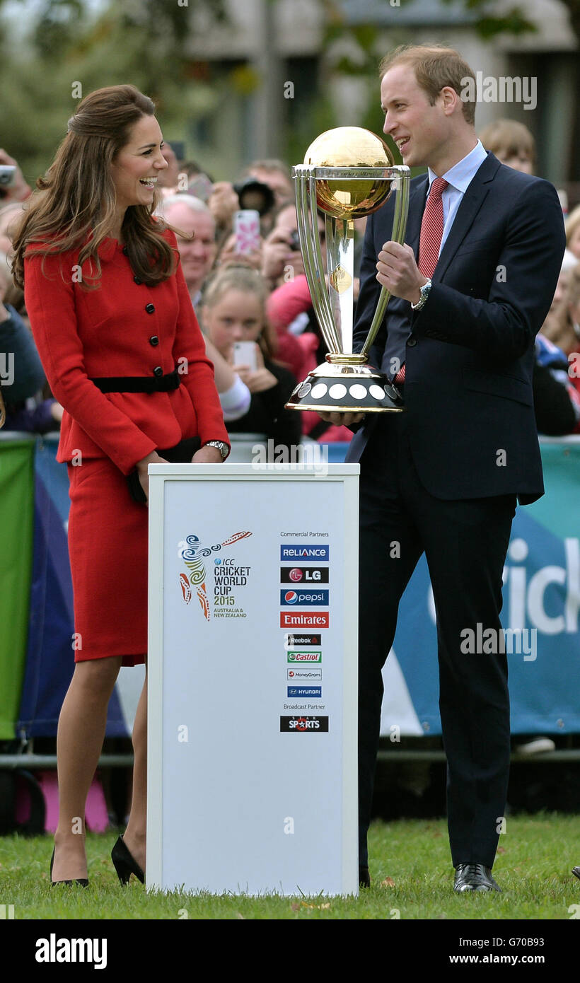 The Duke and Duchess of Cambridge pose with the cricket World Cup as they watch a 2015 Cricket World Cup event in Christchurch during the eighth day of their official tour to New Zealand. Stock Photo