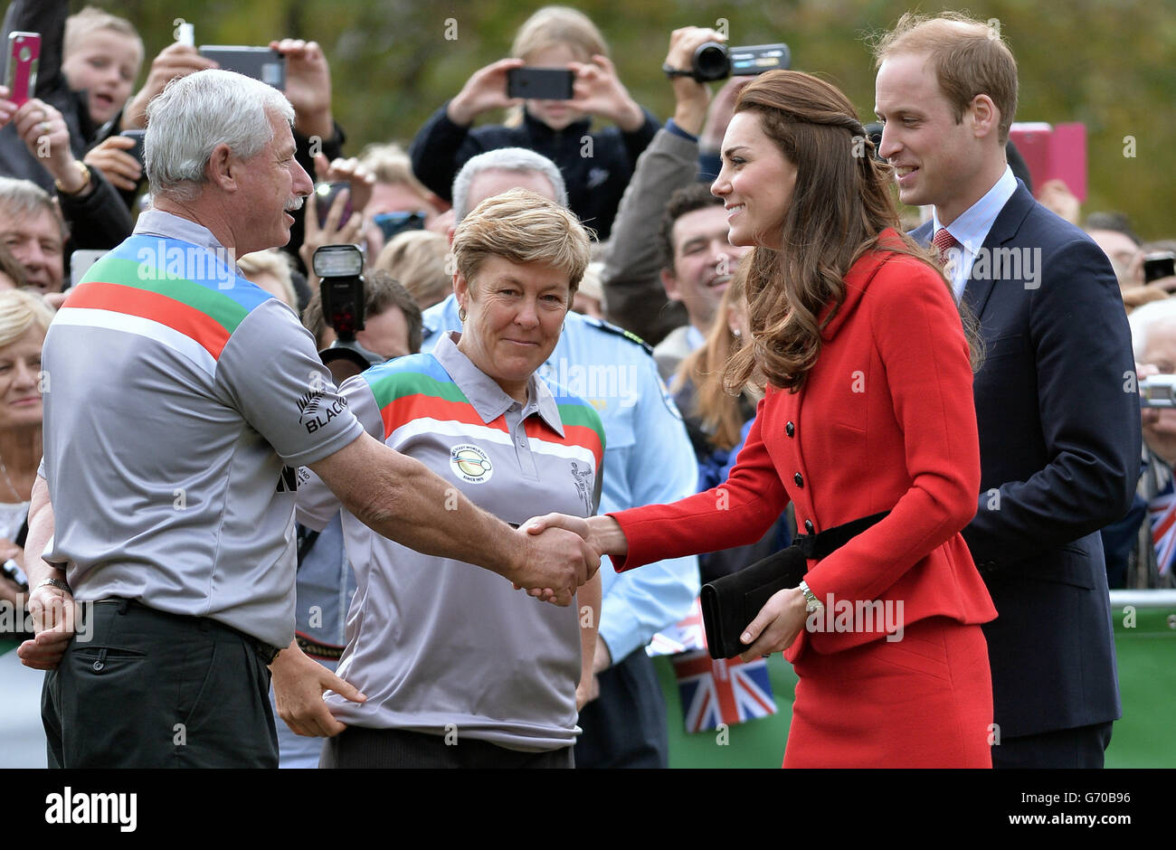 The Duke and Duchess of Cambridge meet Sir Richard Hadlee (left) as they watch a 2015 Cricket World Cup event in Christchurch during the eighth day of their official tour to New Zealand. Stock Photo