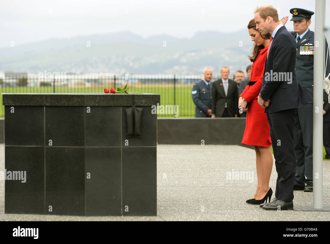 The Duke and Duchess of Cambridge pay their respect after laying roses at the RNZAF Memorial Wall at Wigram Air Force Base, Christchurch during the eighth day of their official tour to New Zealand. Stock Photo