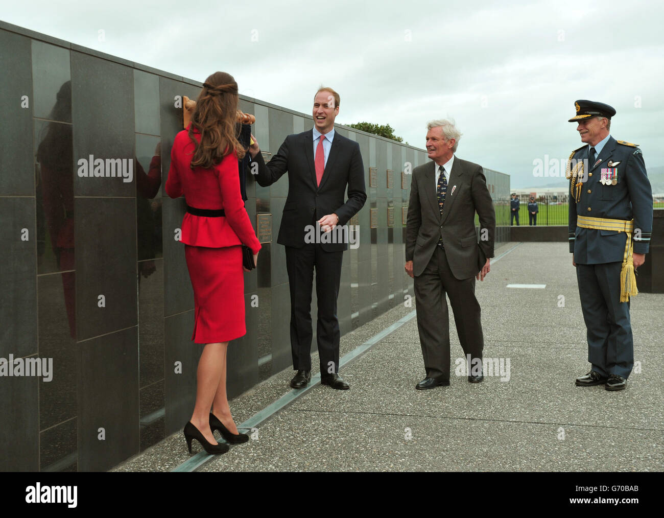 The Duke and Duchess of Cambridge unveil a plaque as they view the RNZAF Memorial Wall at Wigram Air Force Base, Christchurch during the eighth day of their official tour to New Zealand. Stock Photo