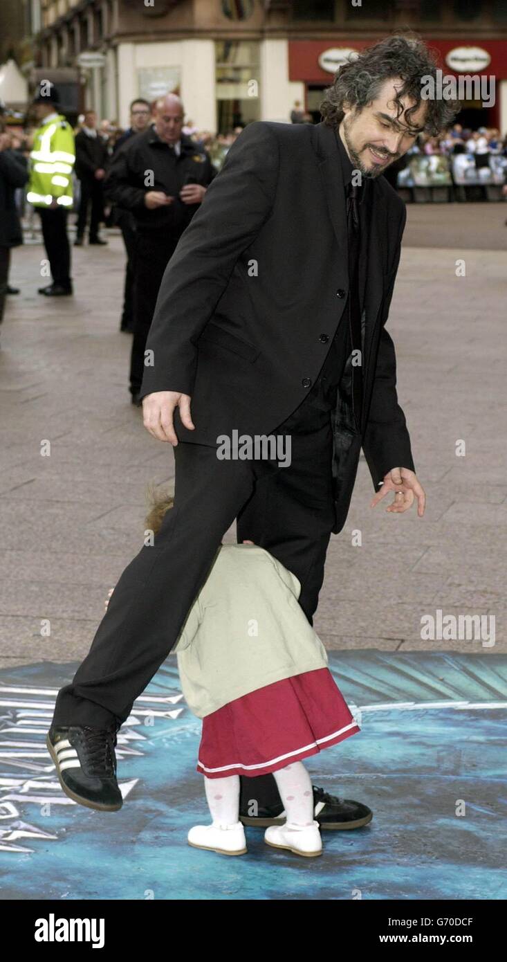 Director Alfonso Cuaron and his daughter Bu arrive for the UK premiere of Harry Potter And The Prisoner of Azkaban at the Odeon Leicester Square in Central London, the third film from author JK Rowling's series of books on the boy wizard. Stock Photo