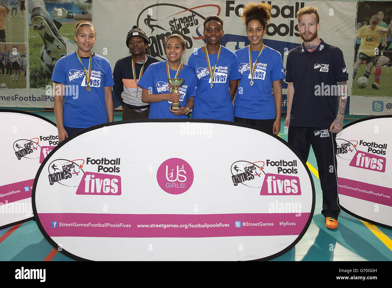 Soccer - StreetGames Football Pools Fives - Trafford Park. The winning team pose for a photograph with the trophy during the StreetGames Football Pools Fives Stock Photo