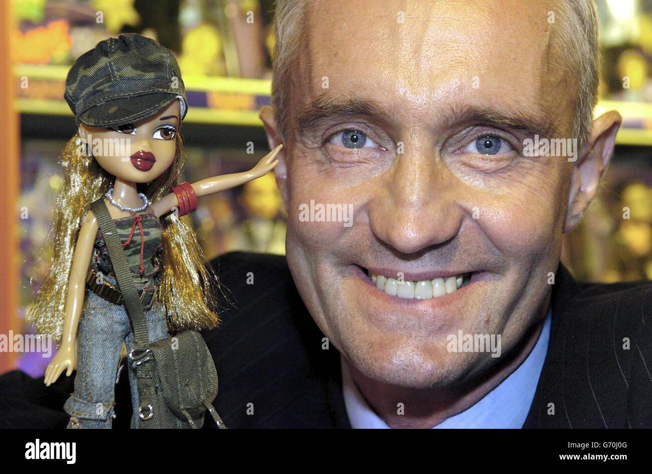 The opening of the new Bratz Shop in Londons Hamleys. Chief executive of Vivid Imaginations Mr Nick Austin holds a Bratz wildlife safari doll, a revolutionary new doll range. 9/9/04: Barbie has been toppled from her long-standing position as the UK's best-selling fashion doll, according to industry figures confirmed. The crown has been passed to Bratz dolls, which were only launched in the UK three years ago. It is the first time Barbie had dropped from the top spot since data was first collected 10 years ago. Stock Photo
