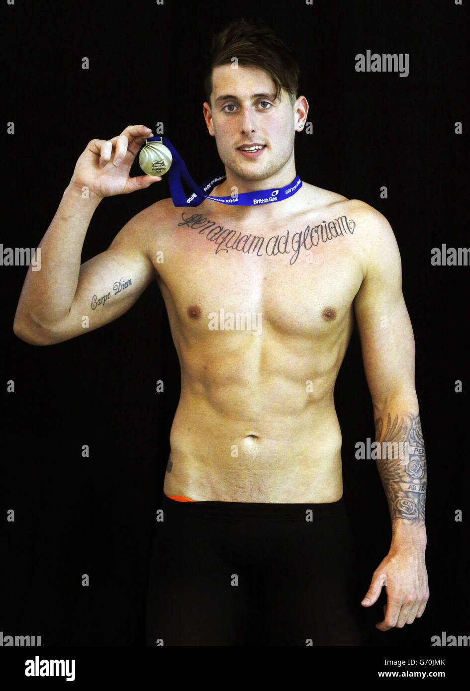 Chris Walker-Hebborn with his medal after winning the Mens Open 50m Backstroke, during the 2014 British Gas Swimming Championships at Tollcross International Swimming Centre, Glasgow. Stock Photo
