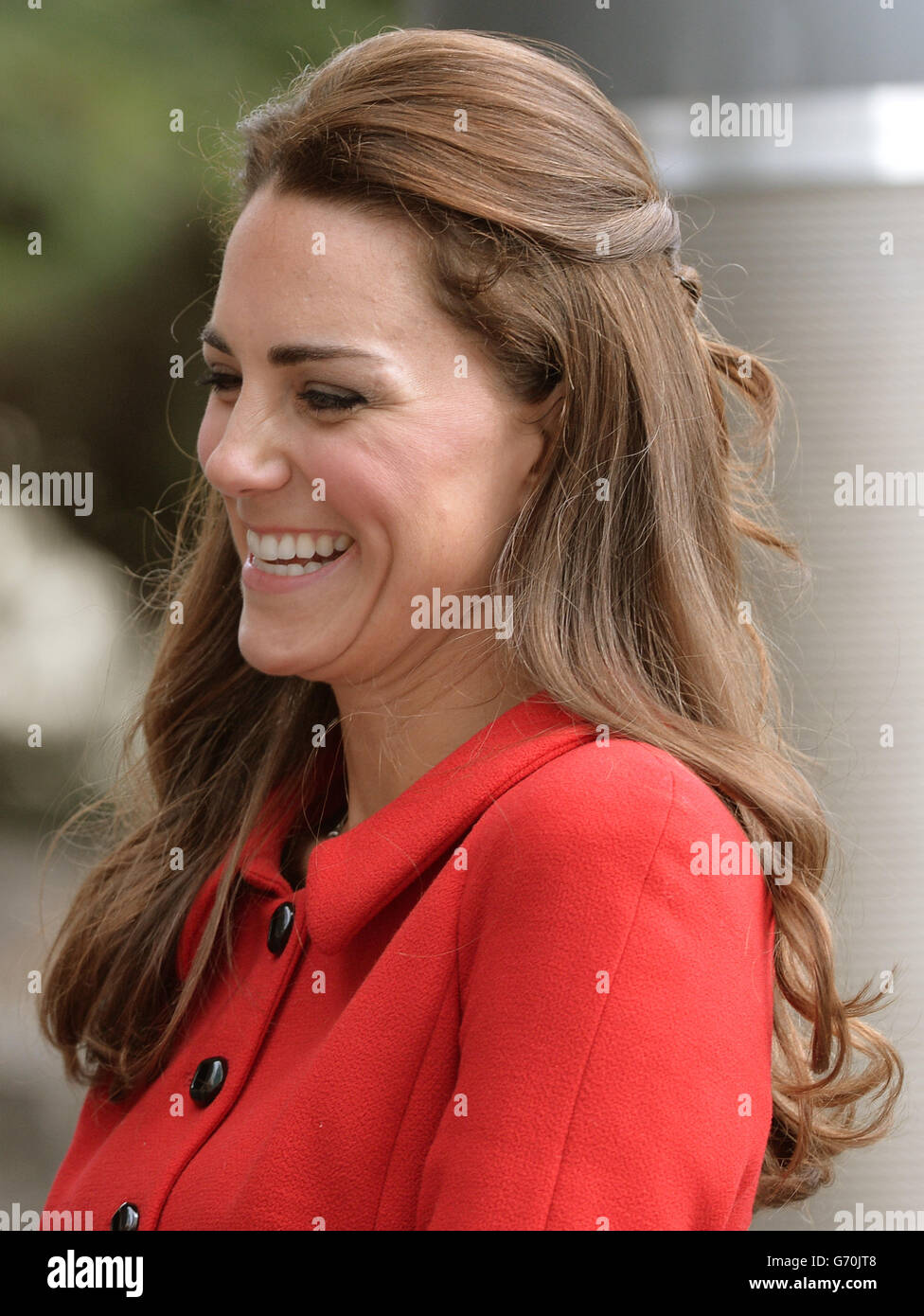 The Duchess of Cambridge smiles as the Duke and Duchess of Cambridge are greeted by members of the Ngai Tahu iwi as they attend a welcome ceremony at Christchurch City Council Building during the eighth day of their official tour to New Zealand. Stock Photo