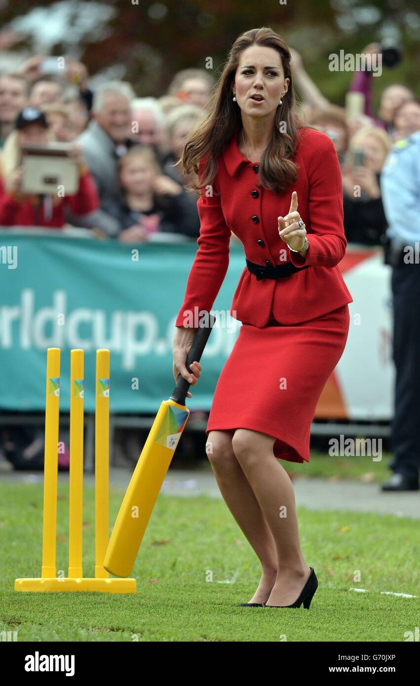 The Duchess of Cambridge reacts after the Duke of Cambridge bowled a full toss delivery as they participates in a 2015 Cricket World Cup event in Christchurch during the eighth day of their official tour to New Zealand. Stock Photo
