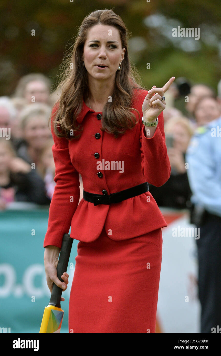 The Duchess of Cambridge reacts after the Duke of Cambridge bowled a full toss delivery as they participates in a 2015 Cricket World Cup event in Christchurch during the eighth day of their official tour to New Zealand. Stock Photo