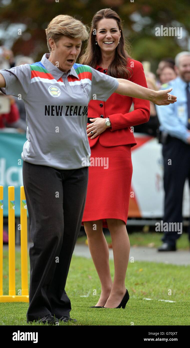The Duchess of Cambridge smiles as the umpire signals a wide after the Duke of Cambridge bowled a full toss delivery as they participates in a 2015 Cricket World Cup event in Christchurch during the eighth day of their official tour to New Zealand. Stock Photo