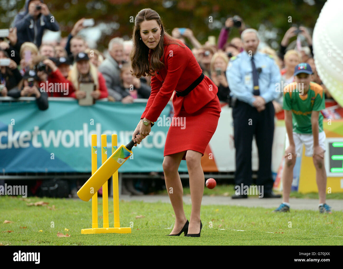 The Duchess of Cambridge bats to The Duke of Cambridge's bowling as they participates in a 2015 Cricket World Cup event in Christchurch during the eighth day of their official tour to New Zealand. Stock Photo