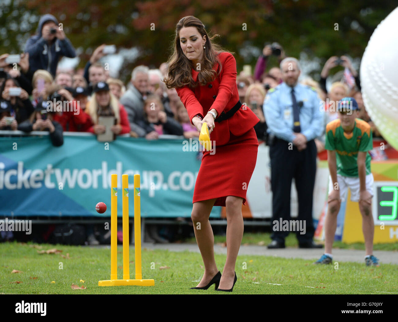 The Duchess of Cambridge bats to The Duke of Cambridge's bowling as they participates in a 2015 Cricket World Cup event in Christchurch during the eighth day of their official tour to New Zealand. Stock Photo