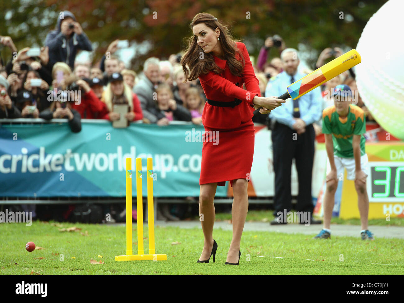 The Duchess of Cambridge bats to The Duke of Cambridge's bowling as they participates in a 2015 Cricket World Cup event in Christchurch during the eighth day of their official tour to New Zealand. Stock Photo