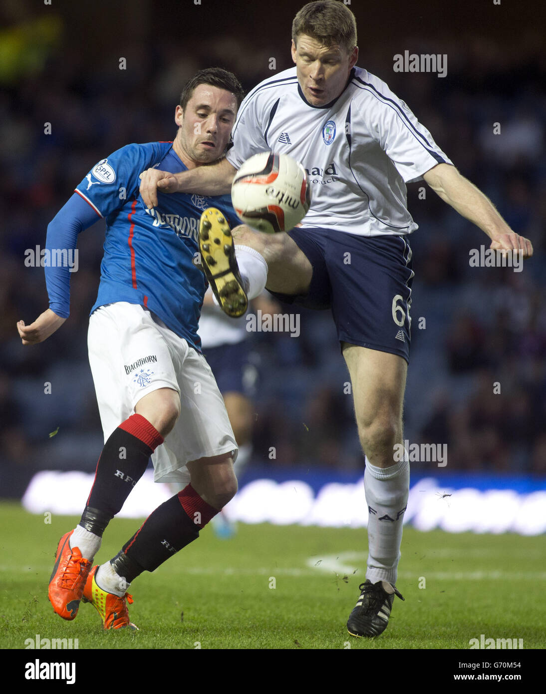 Rangers' Nicky Clark and Forfar Athletic's Darren Dods battle for the ...