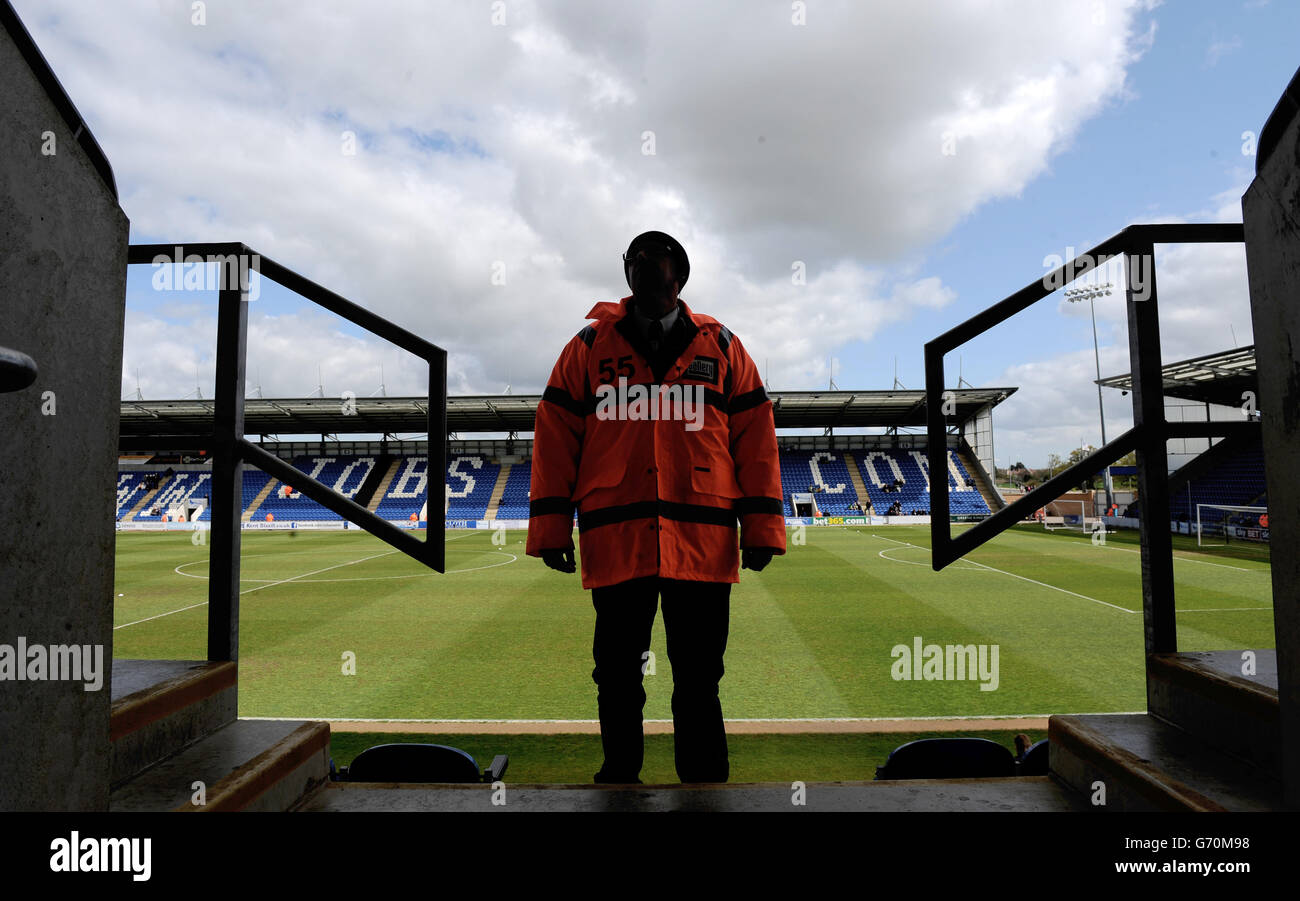 A steward on duty prior to Colchester United v Oldham Athletic Stock Photo