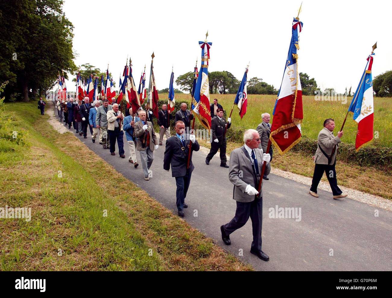 The villagers of Magneville in Normandy march to a memorial in their village to soldiers of the American 101st Airborne Division who were shot down on D-Day in 1944. This weekend see events to mark the 60th anniversary of the allied invasion of Europe. Stock Photo