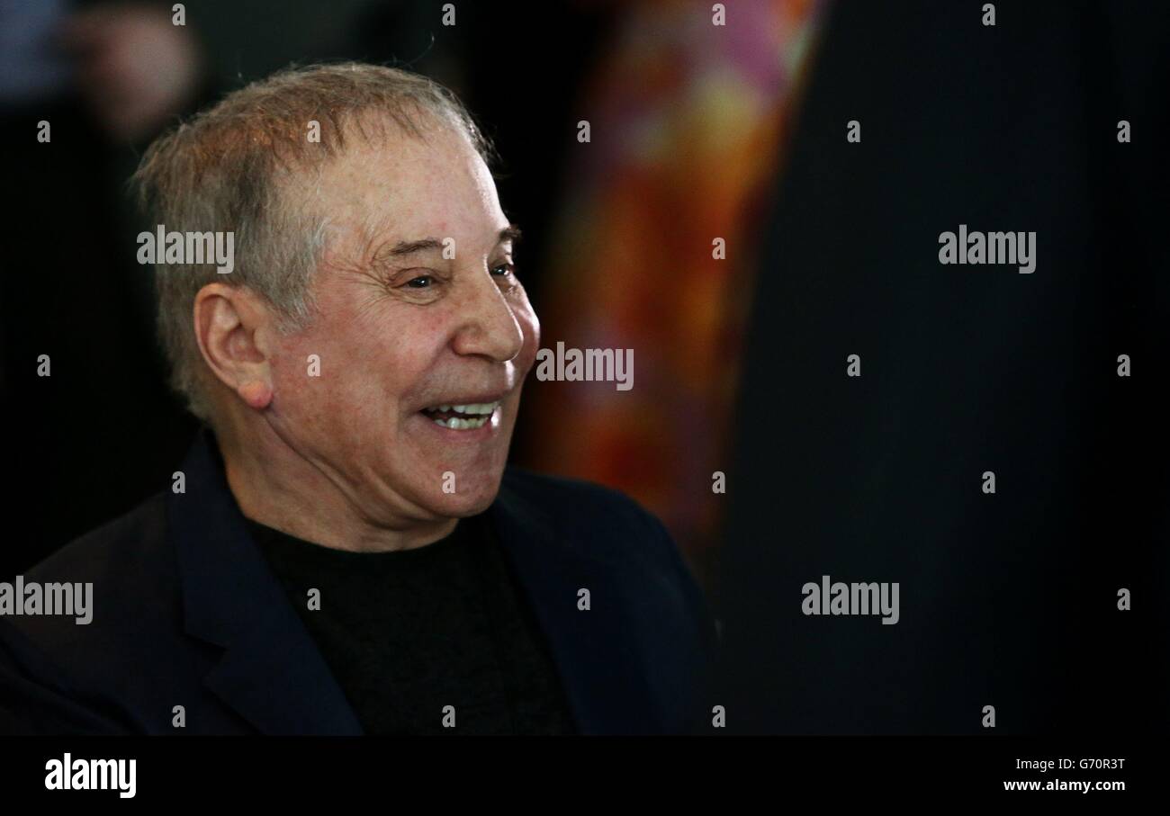 Paul Simon arrives for the unveiling of a specially-commissioned tapestry in honour of the late poet Seamus Heaney, over the Departures Floor of Terminal 2 at Dublin Airport. Stock Photo