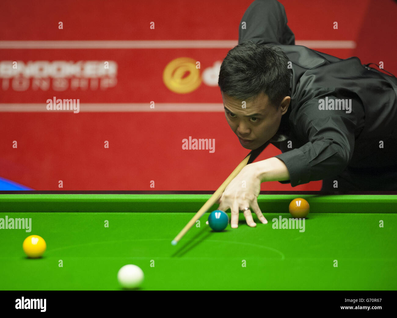 Marco Fu during his match against Martin Gould during the Dafabet World Snooker Championships at The Crucible, Sheffield. PRESS ASSOCIATION Photo. Picture date: Wednesday April 23, 2014. See PA story SNOOKER World. Photo credit should read: Tim Goode/PA Wire Stock Photo