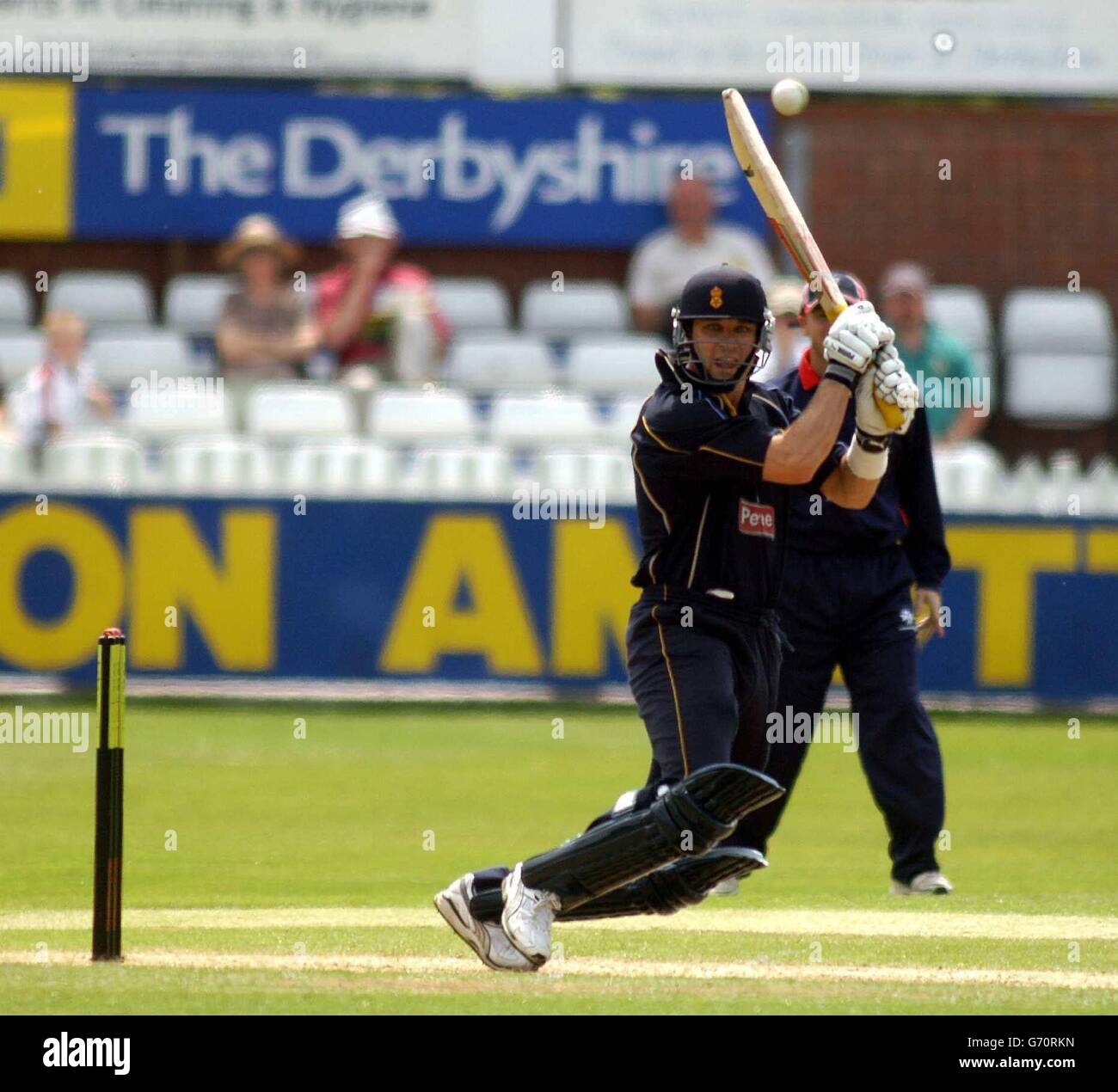 Jonathan Moss of Derbyshire hits a boundary off MIddlesex bowler Nantie Hayward during the Totesport League Division Two match at the County Ground, Derby. Stock Photo