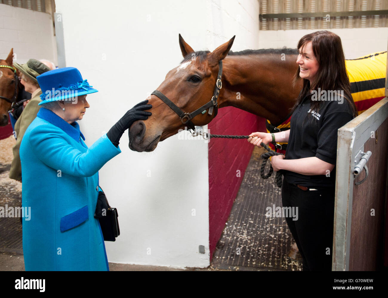 Queen Elizabeth II with horse Teaforthree and Rebecca Morris (right) of