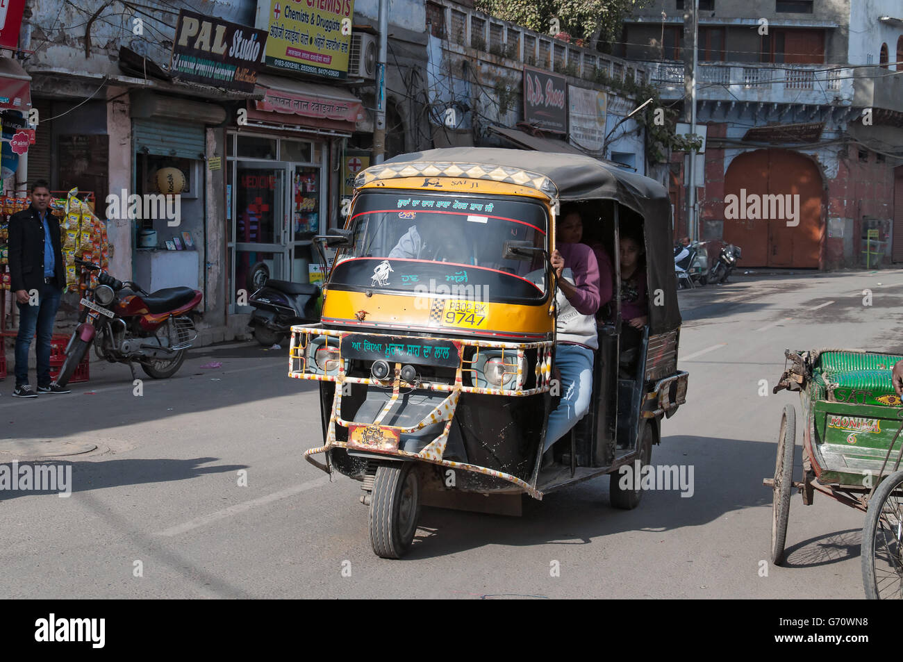 Auto rickshaw or tuk-tuk on the street. Auto rickshaws are a common means of public transportat Stock Photo