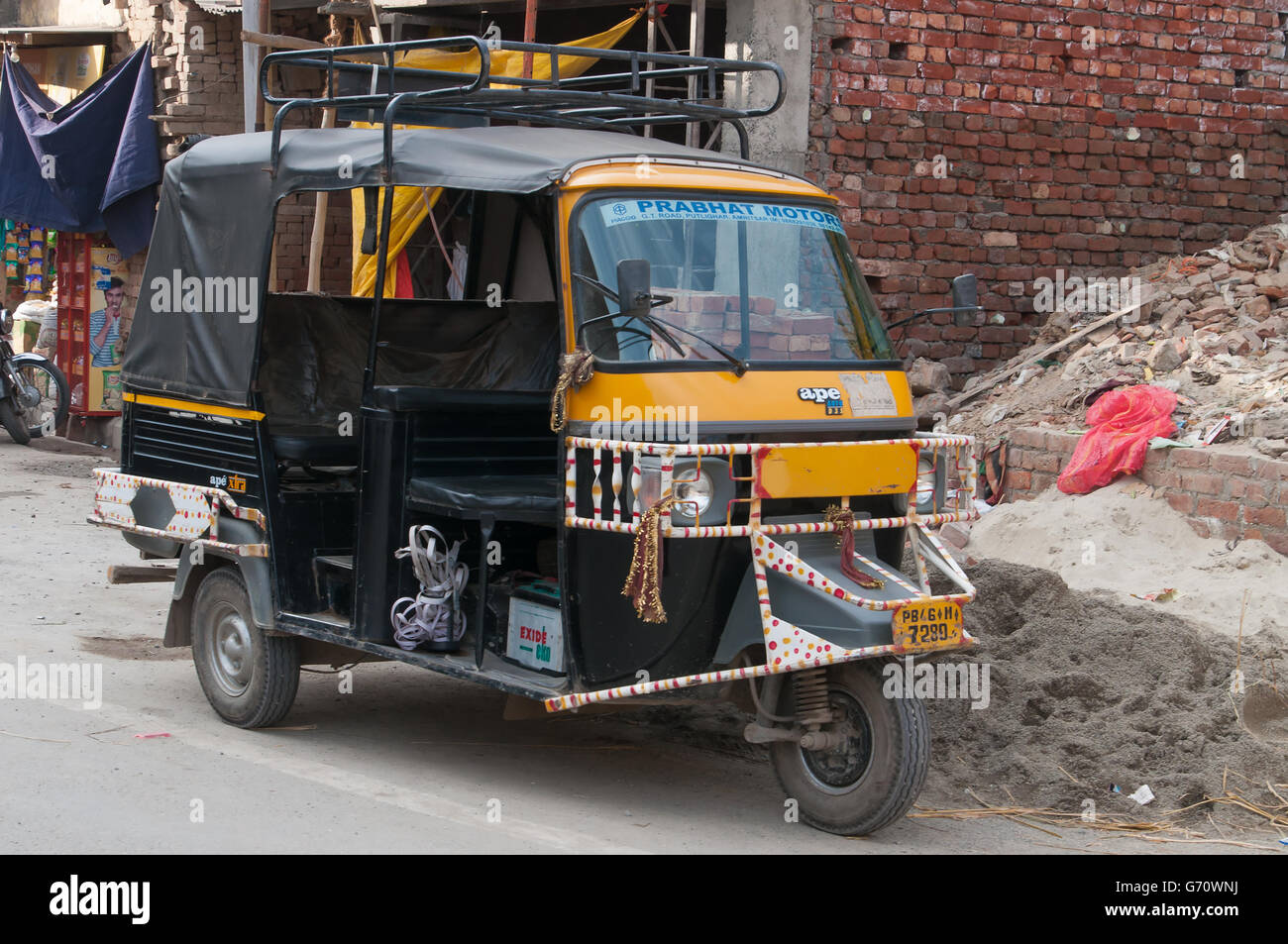 Auto rickshaw or tuk-tuk on the street. Auto rickshaws are a common means of public transportat Stock Photo