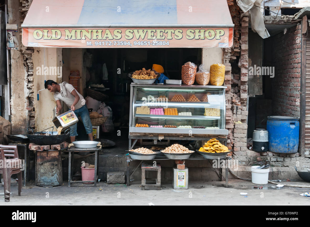 Indian local sweet and snack shop.  Amritsar home to the Harmandir Sahib (Golden Temple), Stock Photo