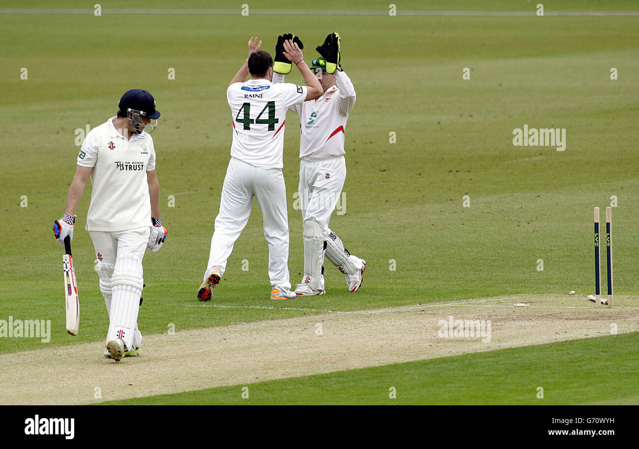 Glamorgan's Gareth Rees looks back at his stumps after being bowled out by Leicestershire's Ben Raine (centre) during day two of the LV= County Championship, Division Two match at Grace Road, Leicester. Stock Photo