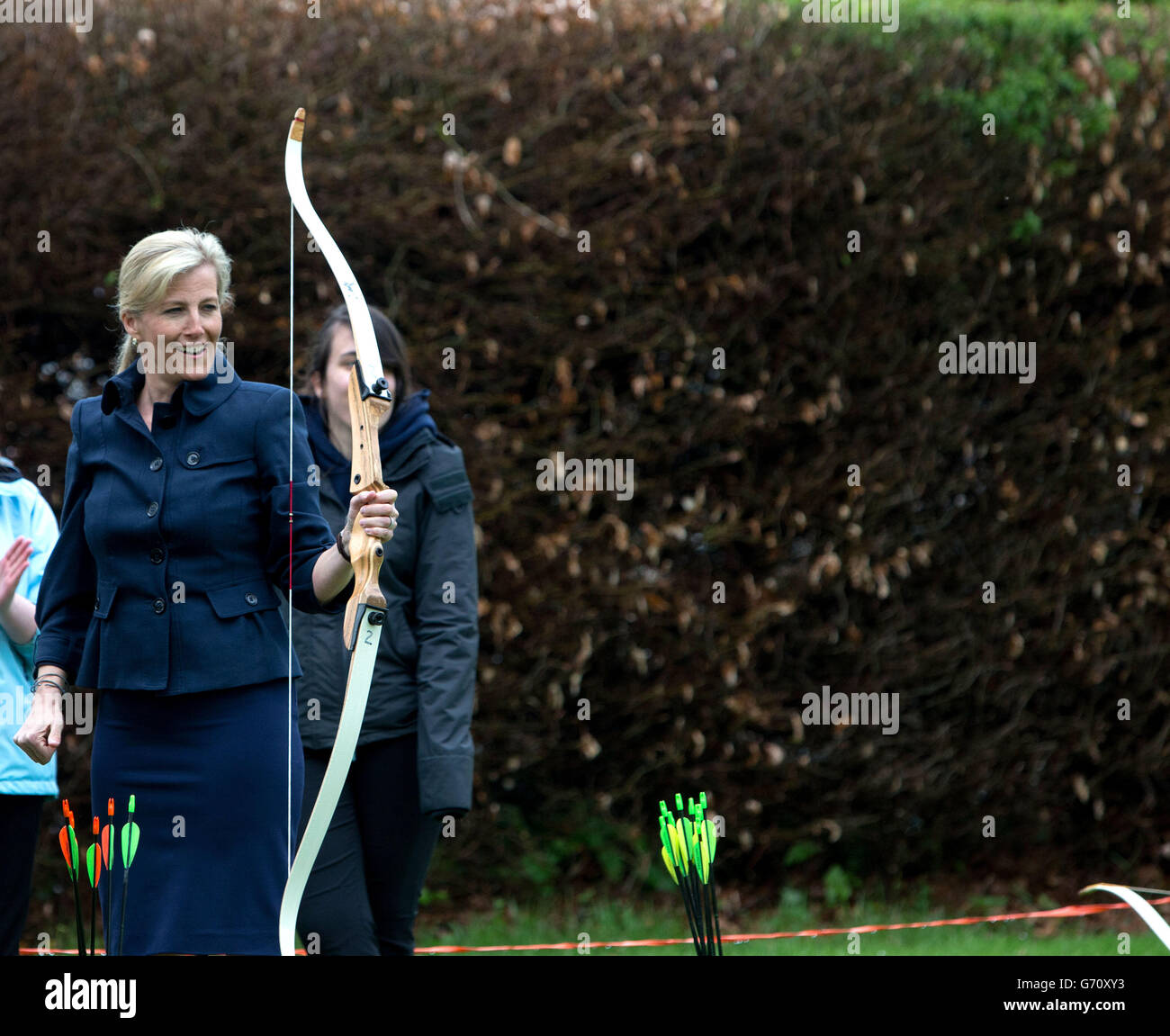 The Countess of Wessex has a go at archery during a visit to the