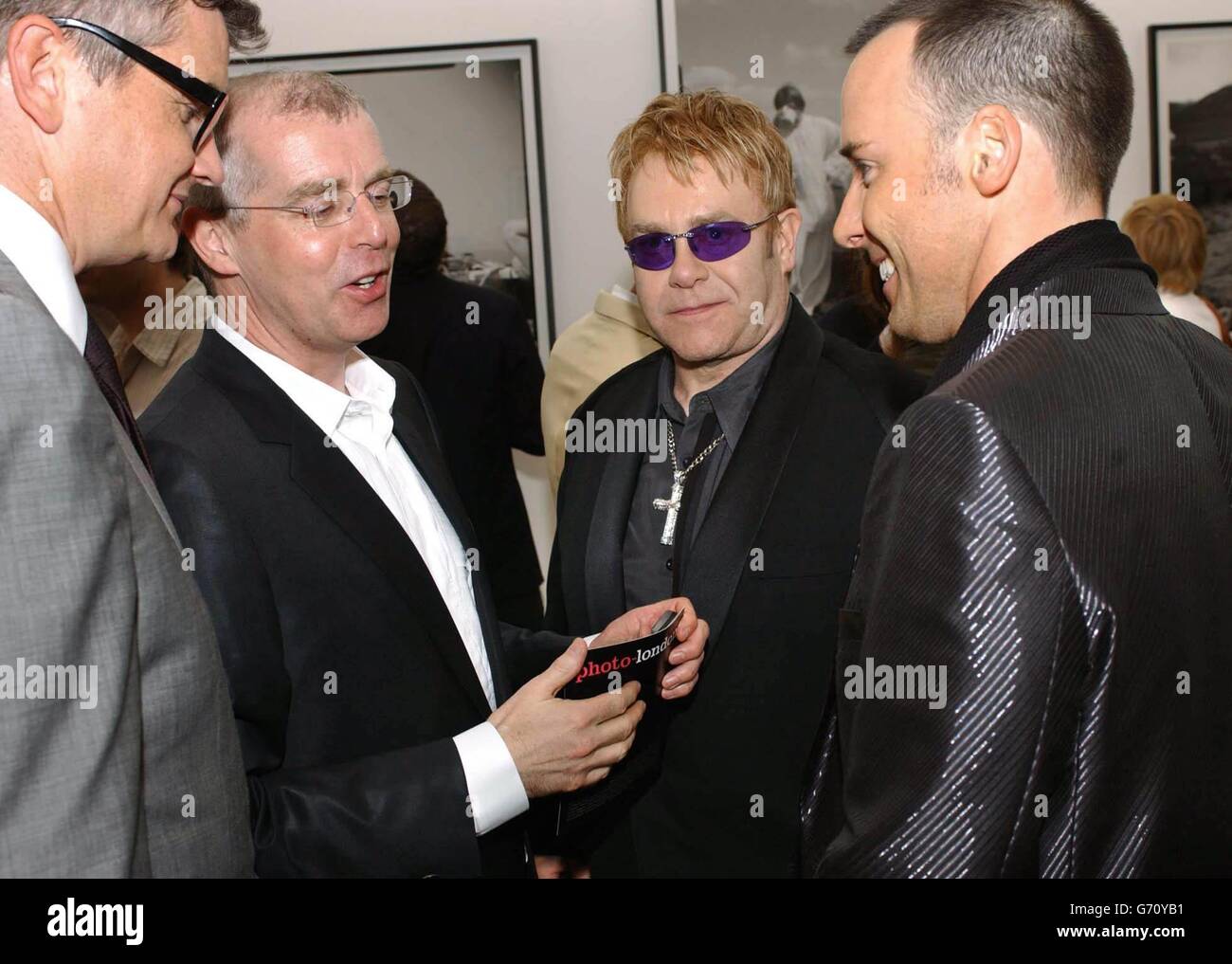From left to right) art dealer Jay Joplin, musician Neil Tennant, singer  Sir Elton John and his partner David Furnish during the private view of  photo-london, the first annual art fair in