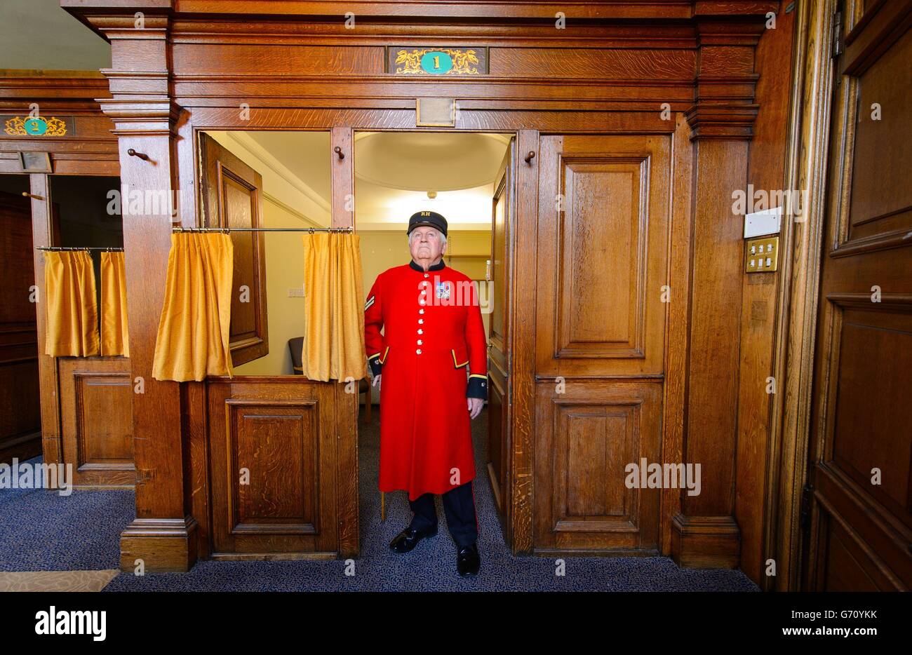 Chelsea Pensioner Tom Mullaney stands in his old room on one of the original Long Wards, at the Royal Chelsea Hospital, in Chelsea, west London. Stock Photo