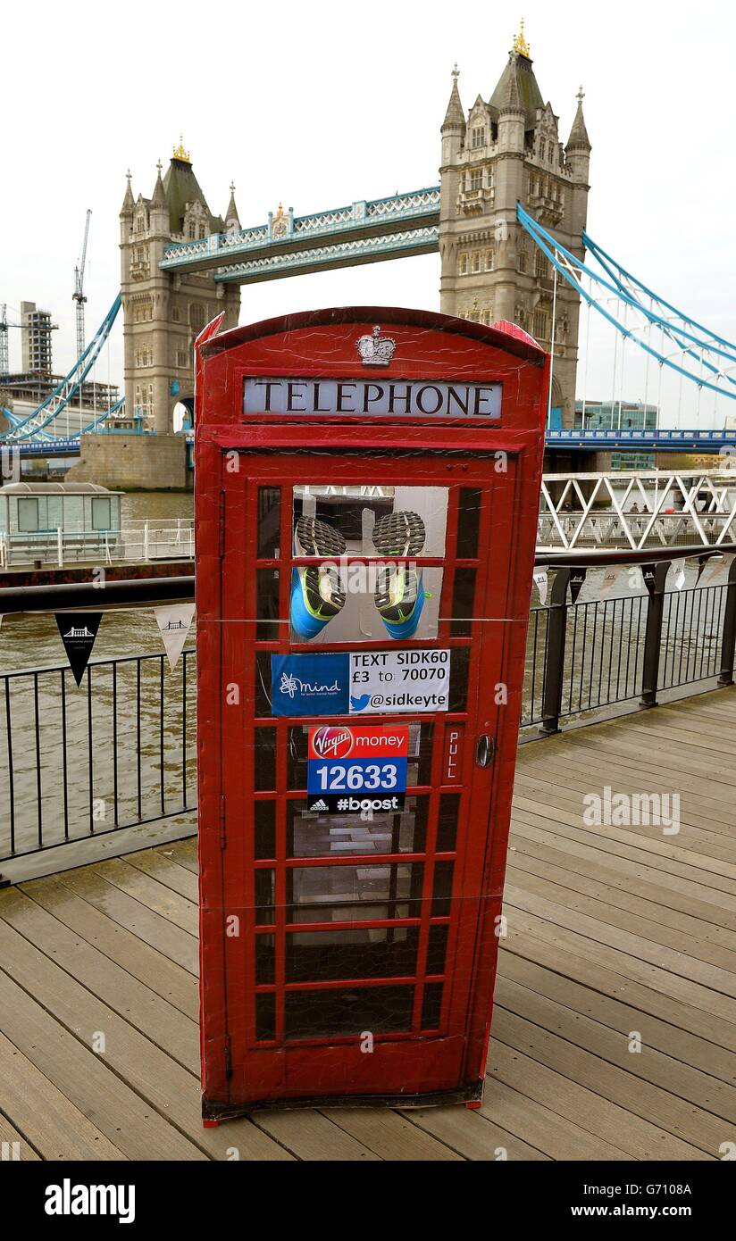 Sid Keyte aged 43 from Salisbury in his home-made telephone box in which he  will run for charity during the photocall at Tower Bridge, London Stock  Photo - Alamy