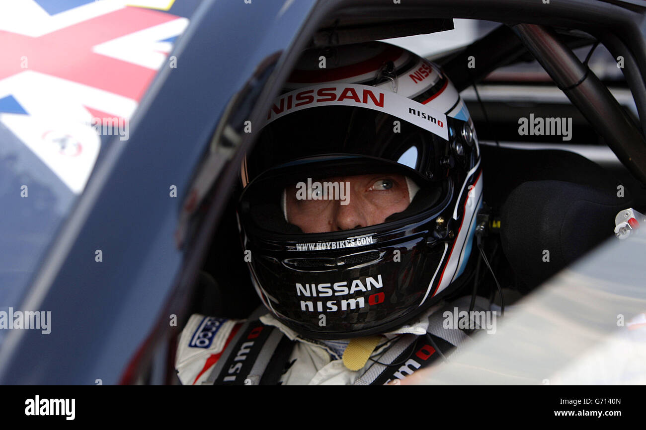 Sir Chris Hoy sits in his Nissan GT Academy Team car prior to a warm up lap during the Avon Tyres British GT Championship at Oulton Park, Cheshire. Stock Photo
