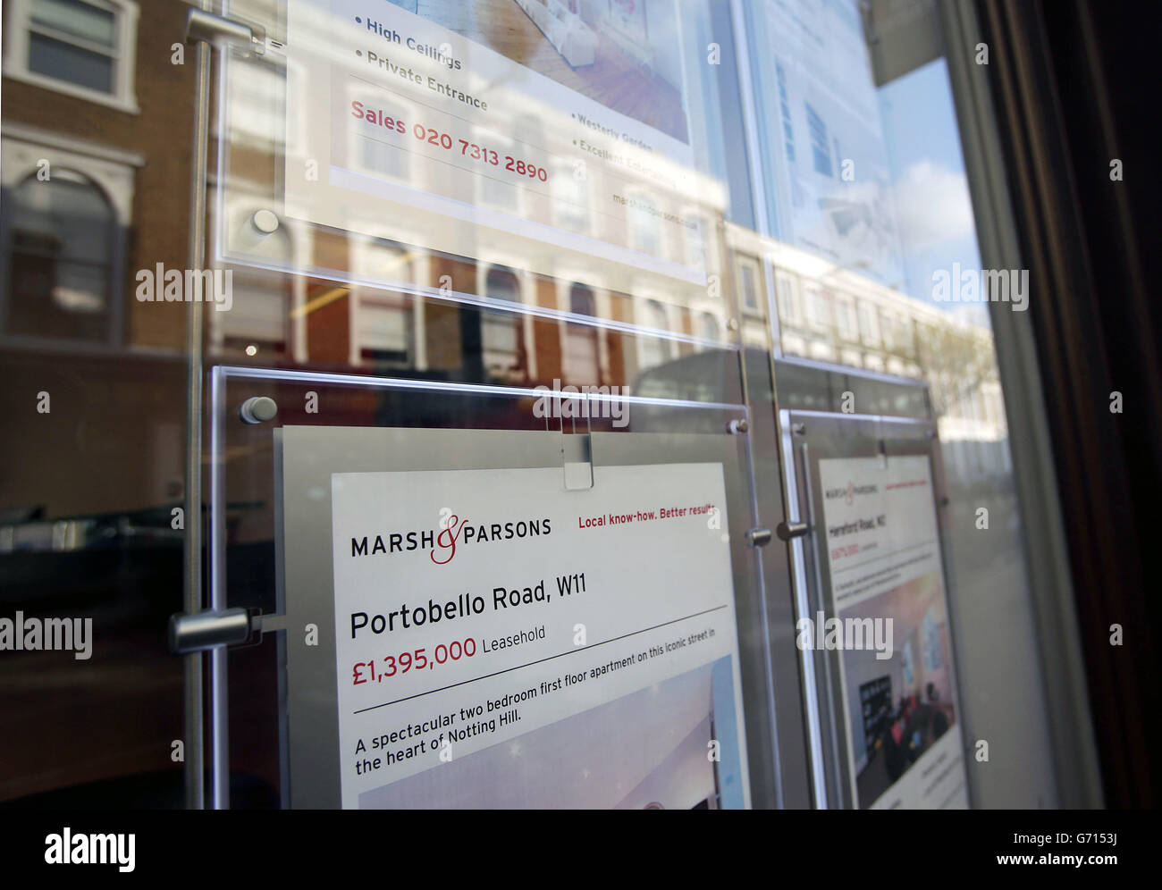 Property for sale signs displayed in the window of Marsh & Parsons estate agents in Notting Hill, London. Stock Photo